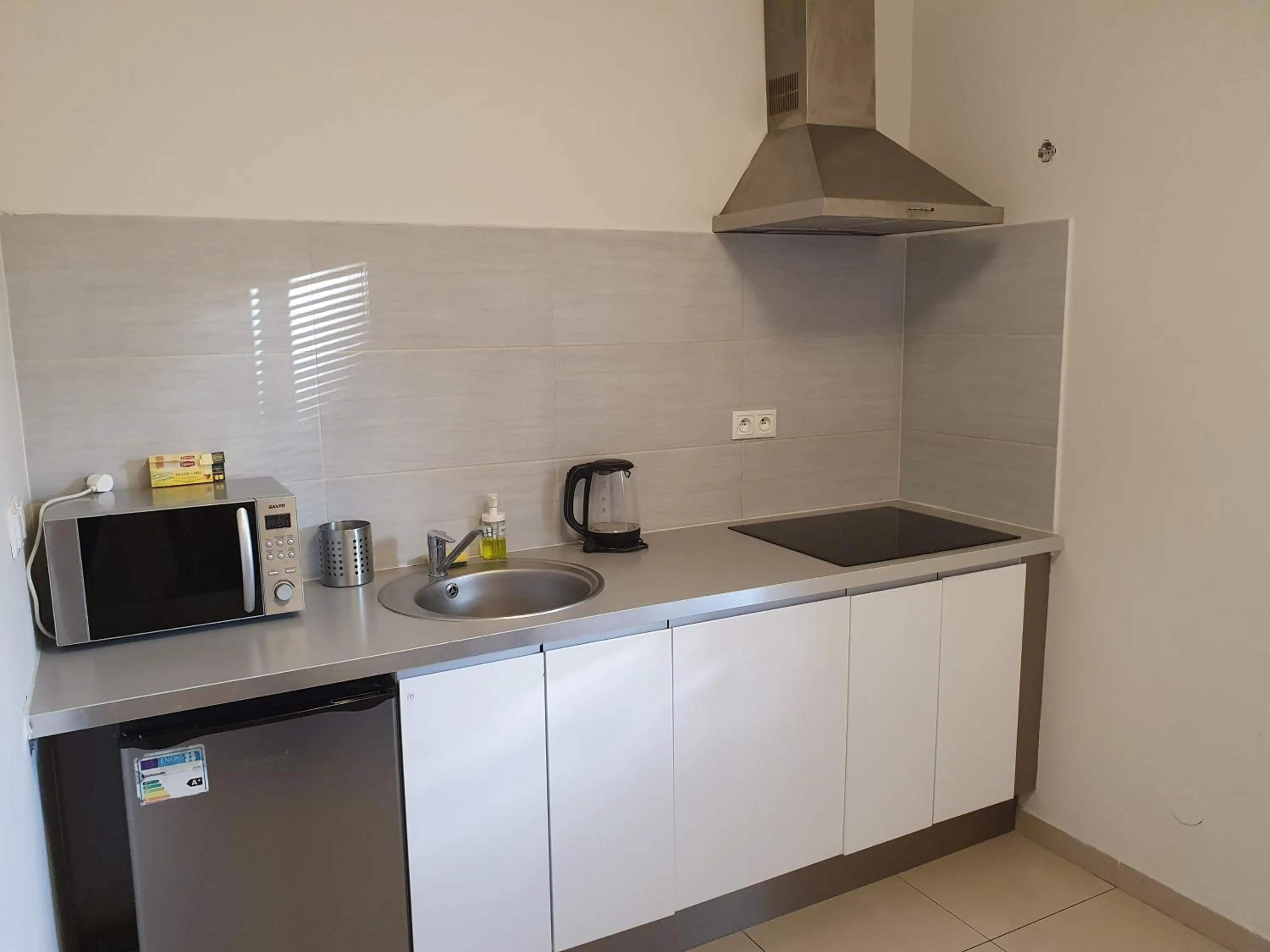 Kitchen or kitchenette in NotaBene Wola Apartment