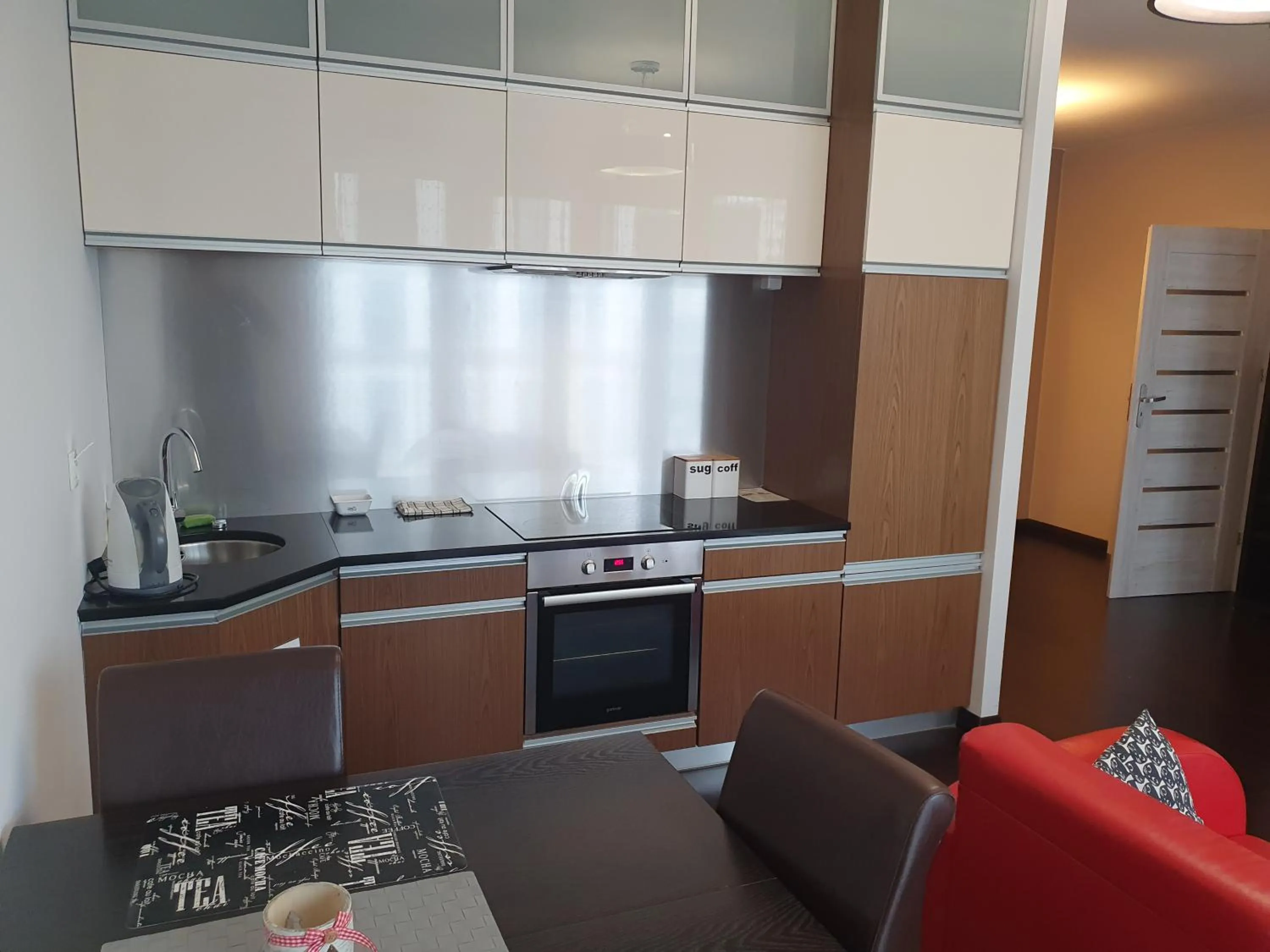 Kitchen or kitchenette in NotaBene Wola Apartment