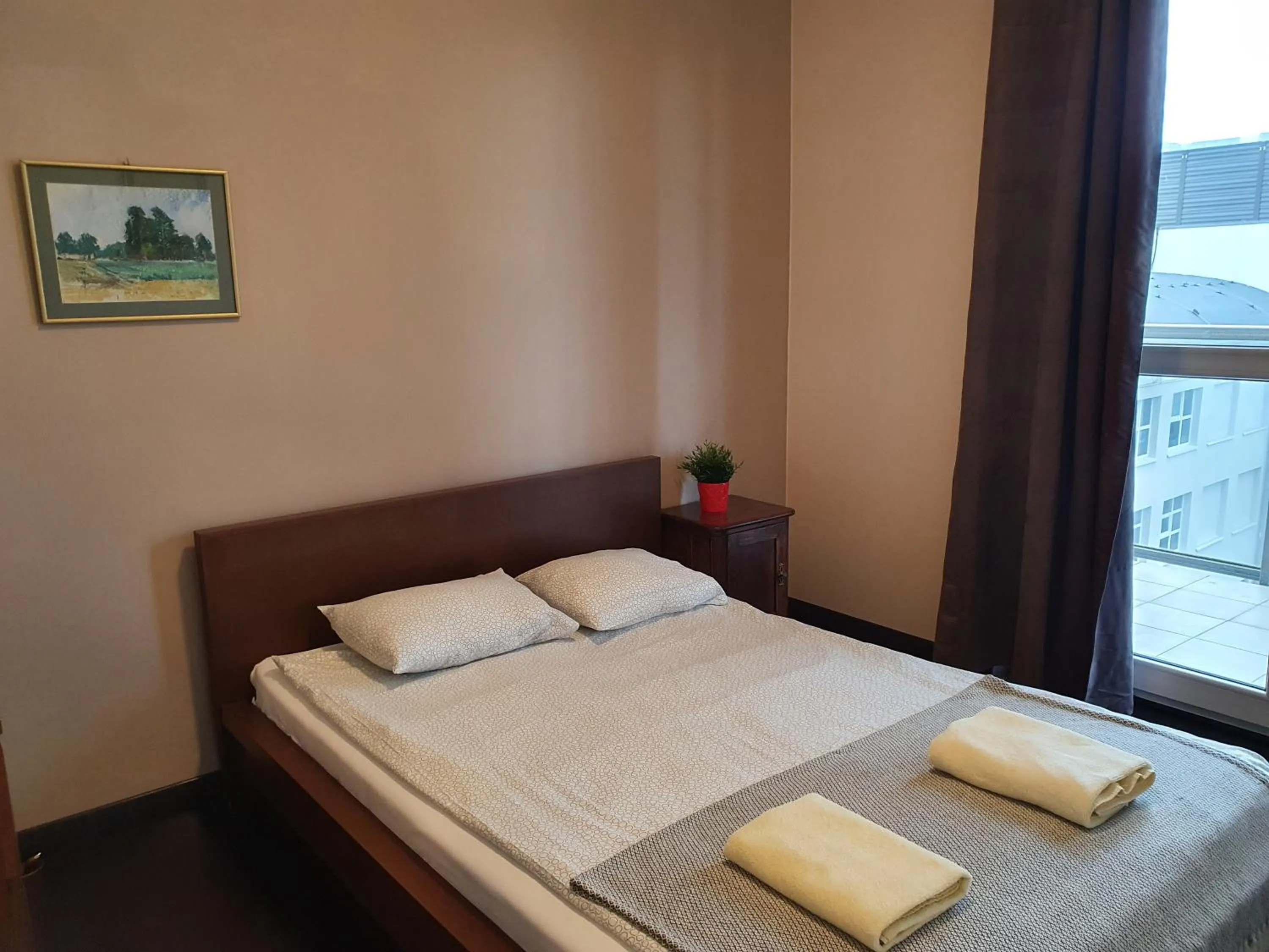 Bed in NotaBene Wola Apartment