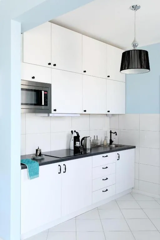 Kitchen or kitchenette in NotaBene Wola Apartment