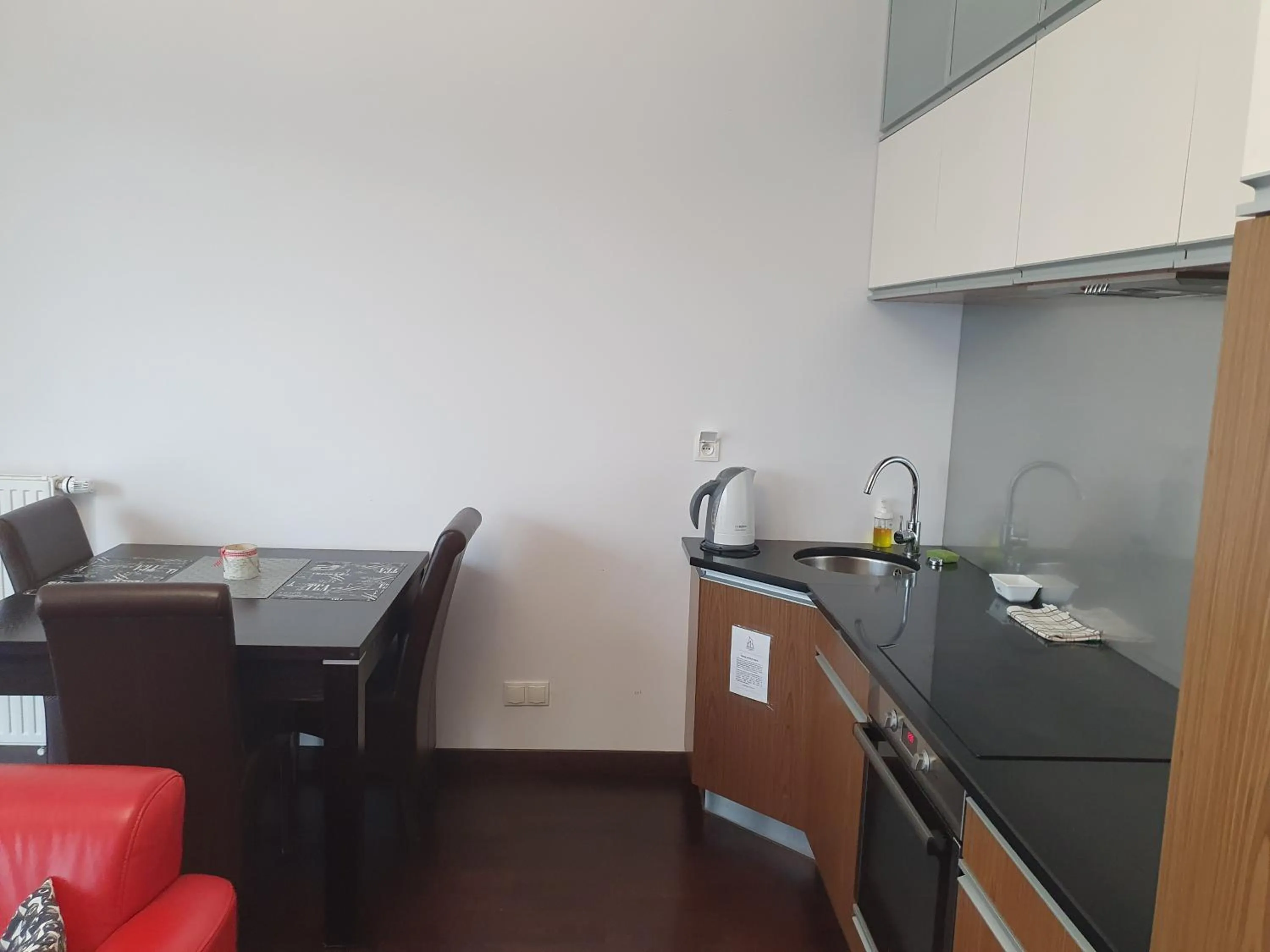Kitchen or kitchenette in NotaBene Wola Apartment