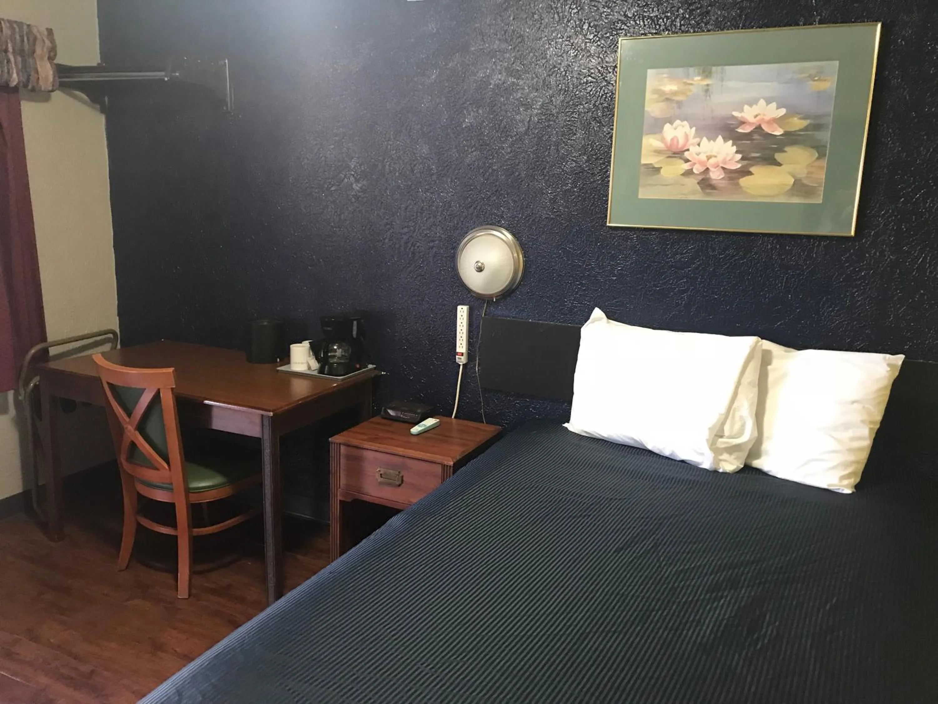 Bed in Cooper Motel Tuscola