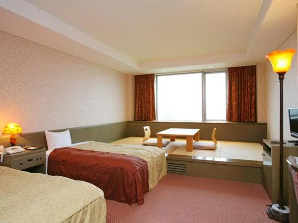 Bed in Izumigo Kiyosato Kogen Hotel