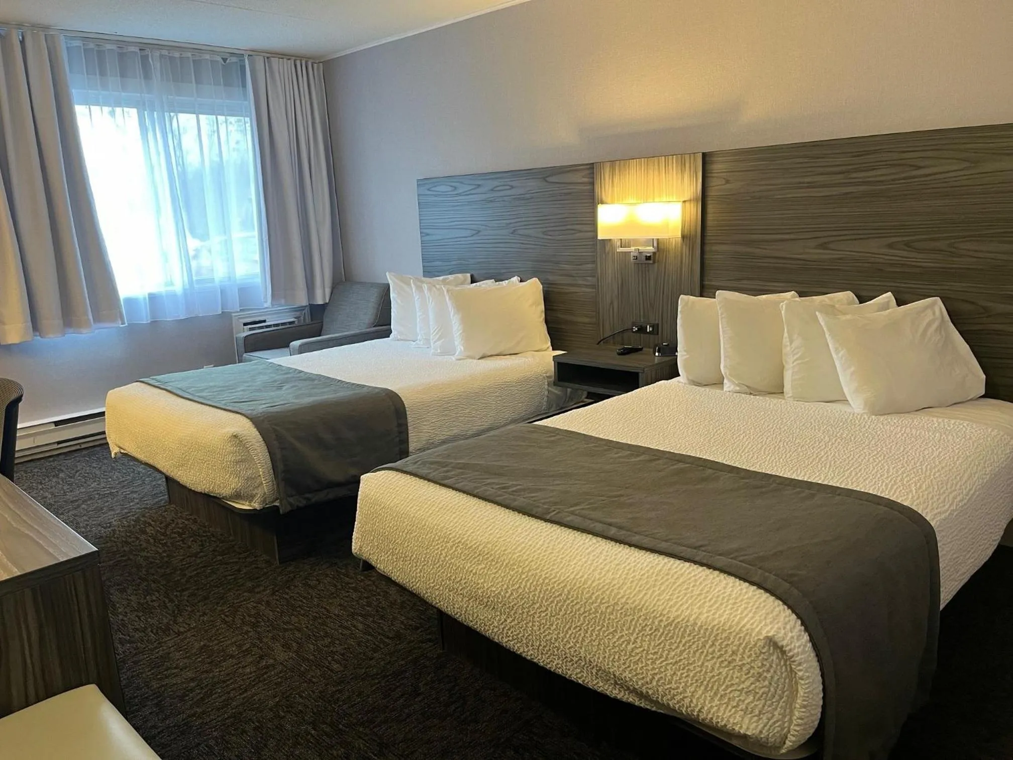 Seating area, Bed in Travelodge by Wyndham Ottawa East