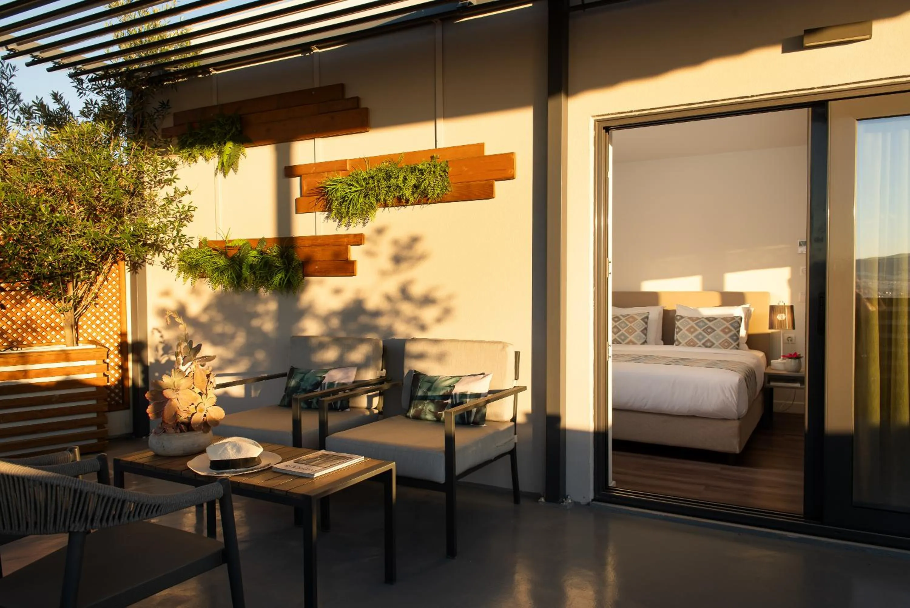 Patio, Bed in Urban Nest - Suites & Apartments