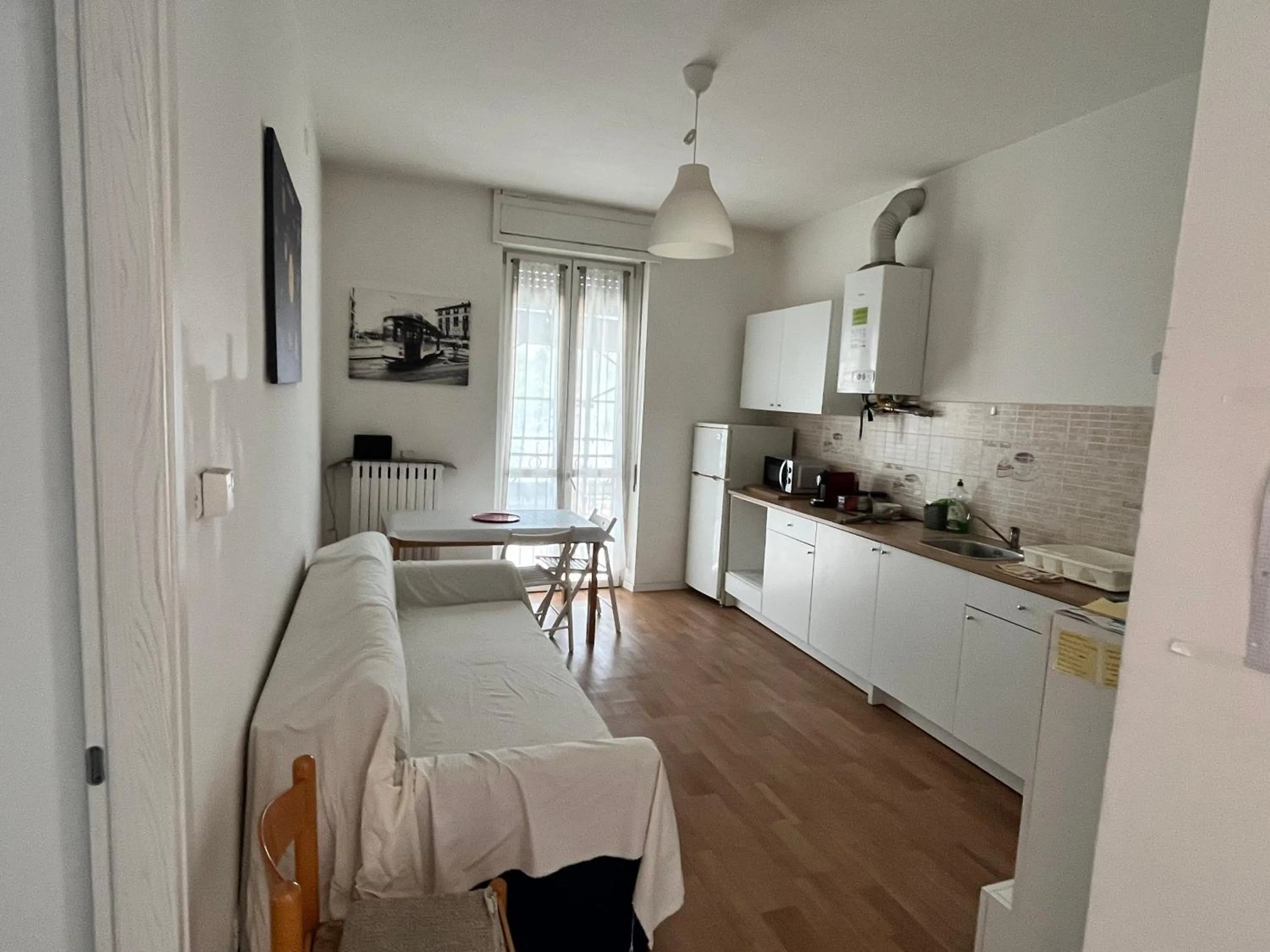 Kitchen or kitchenette in Room Saronno + B&B