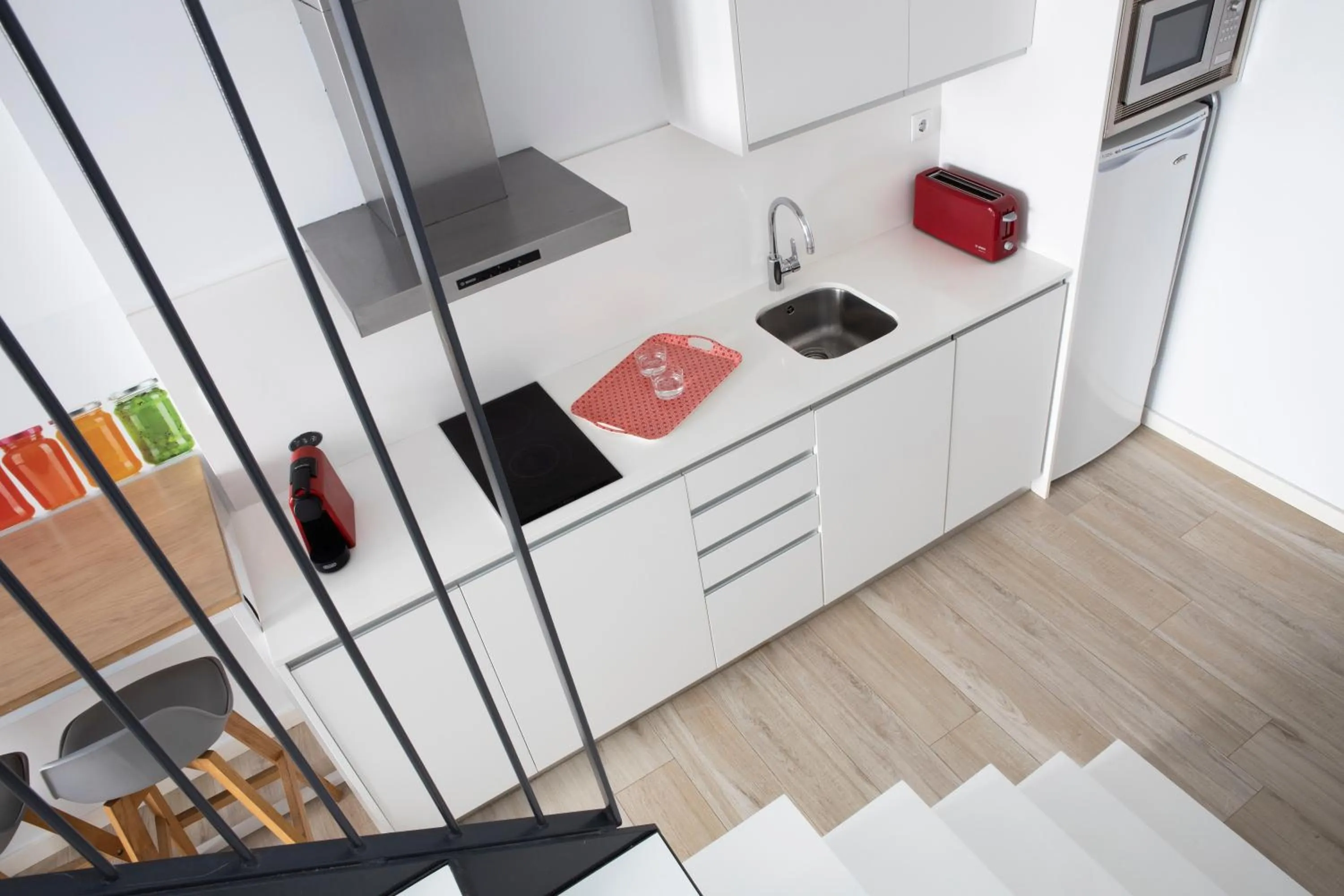 Kitchen or kitchenette in Urban Suites Sitges Apartments by PriorityVillas