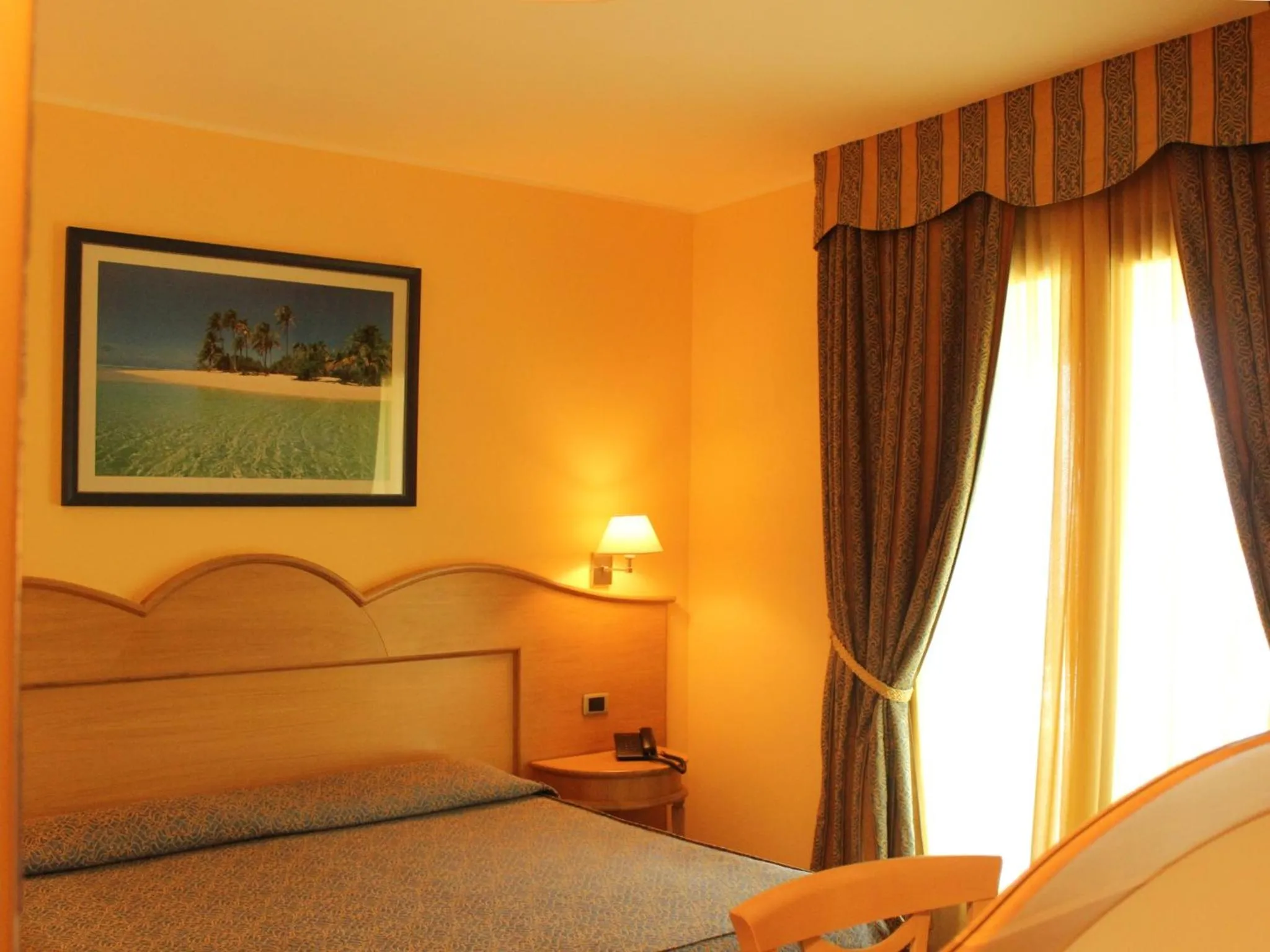 Bed in Blu Tropical Resort