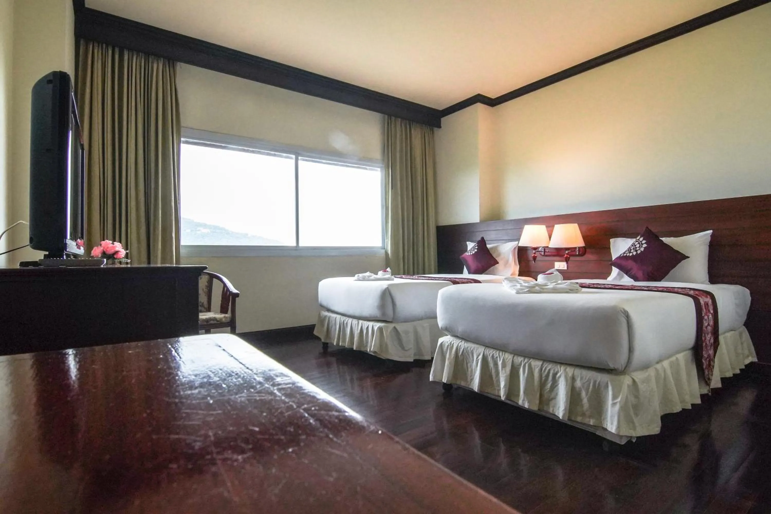 Bed in Arawan Riverside Hotel