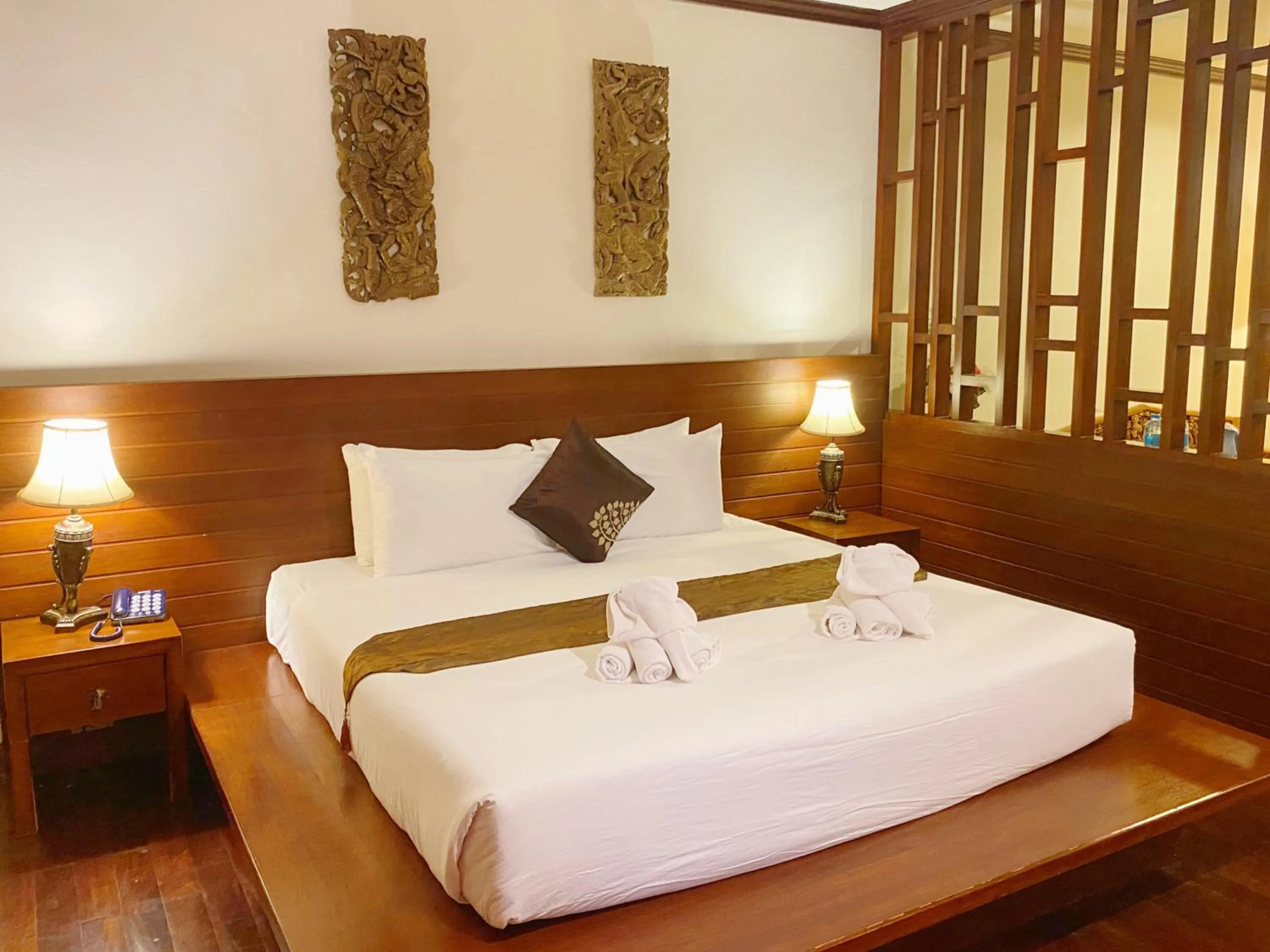 Bed in Arawan Riverside Hotel