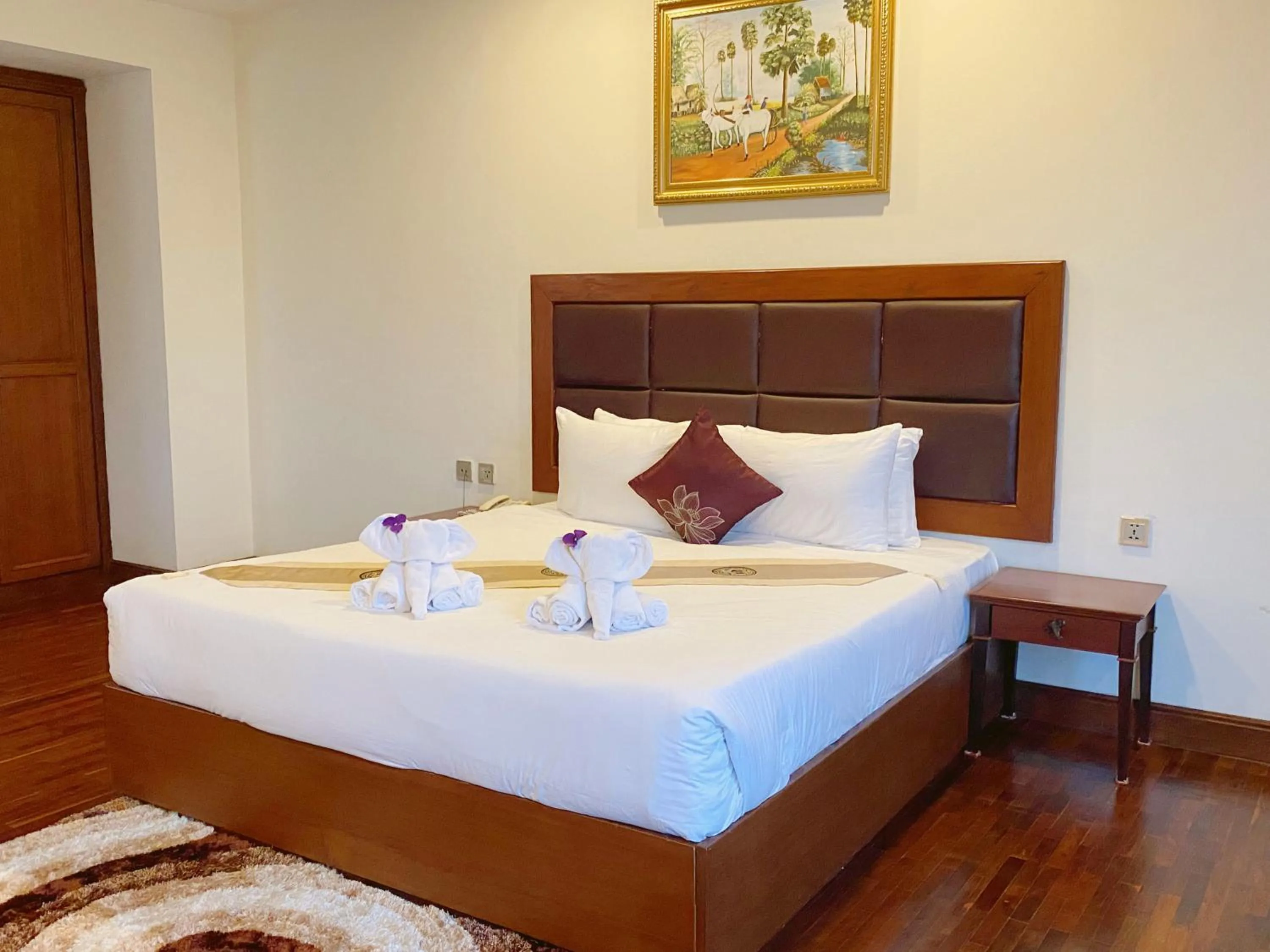 Bed in Arawan Riverside Hotel