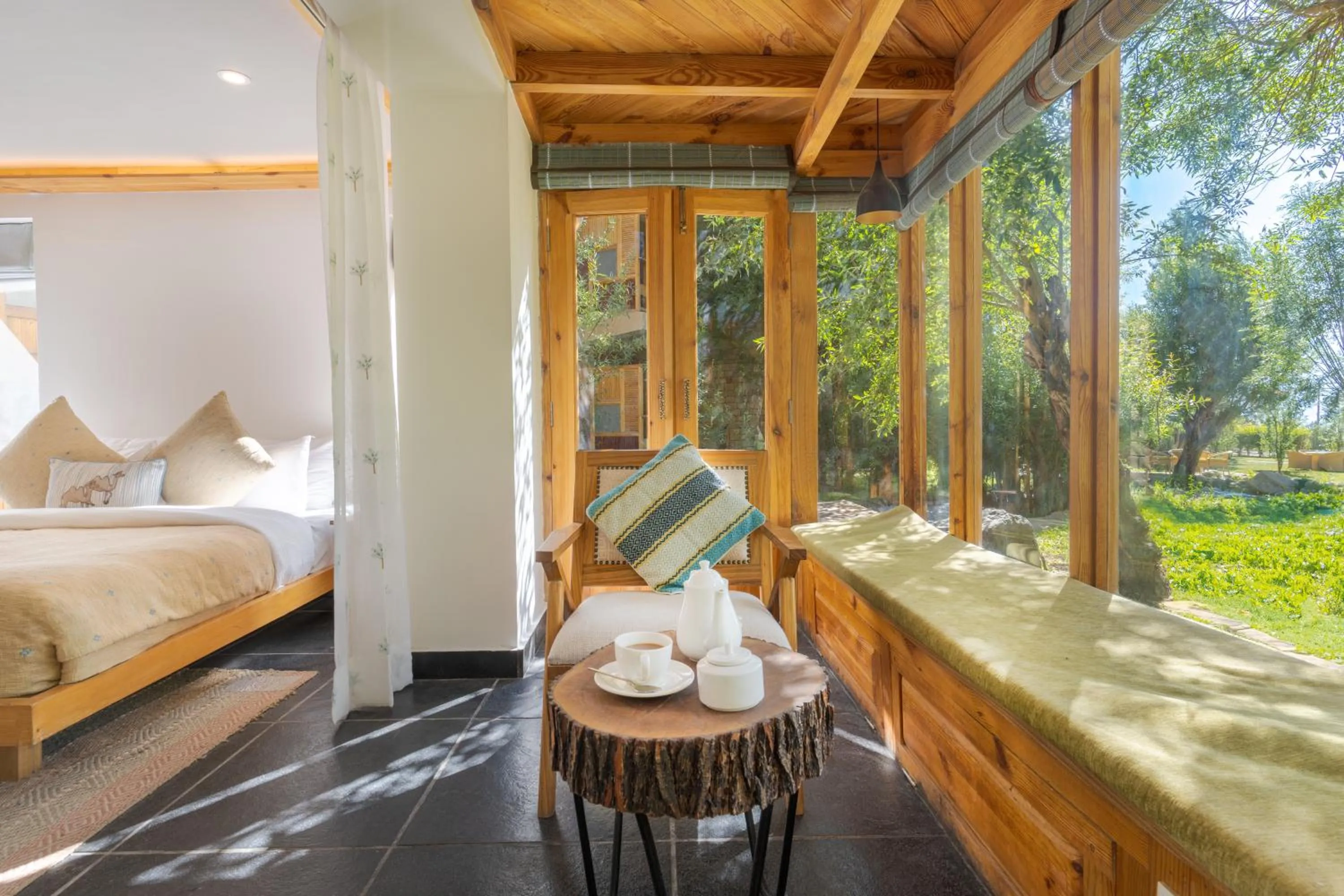 Seating area, Bed in Stone Hedge Hotel