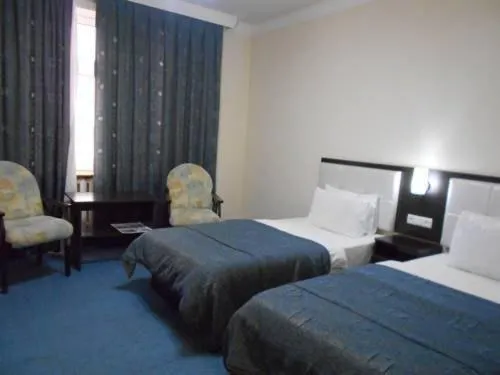 Bed in GRAND STAR HOTEL