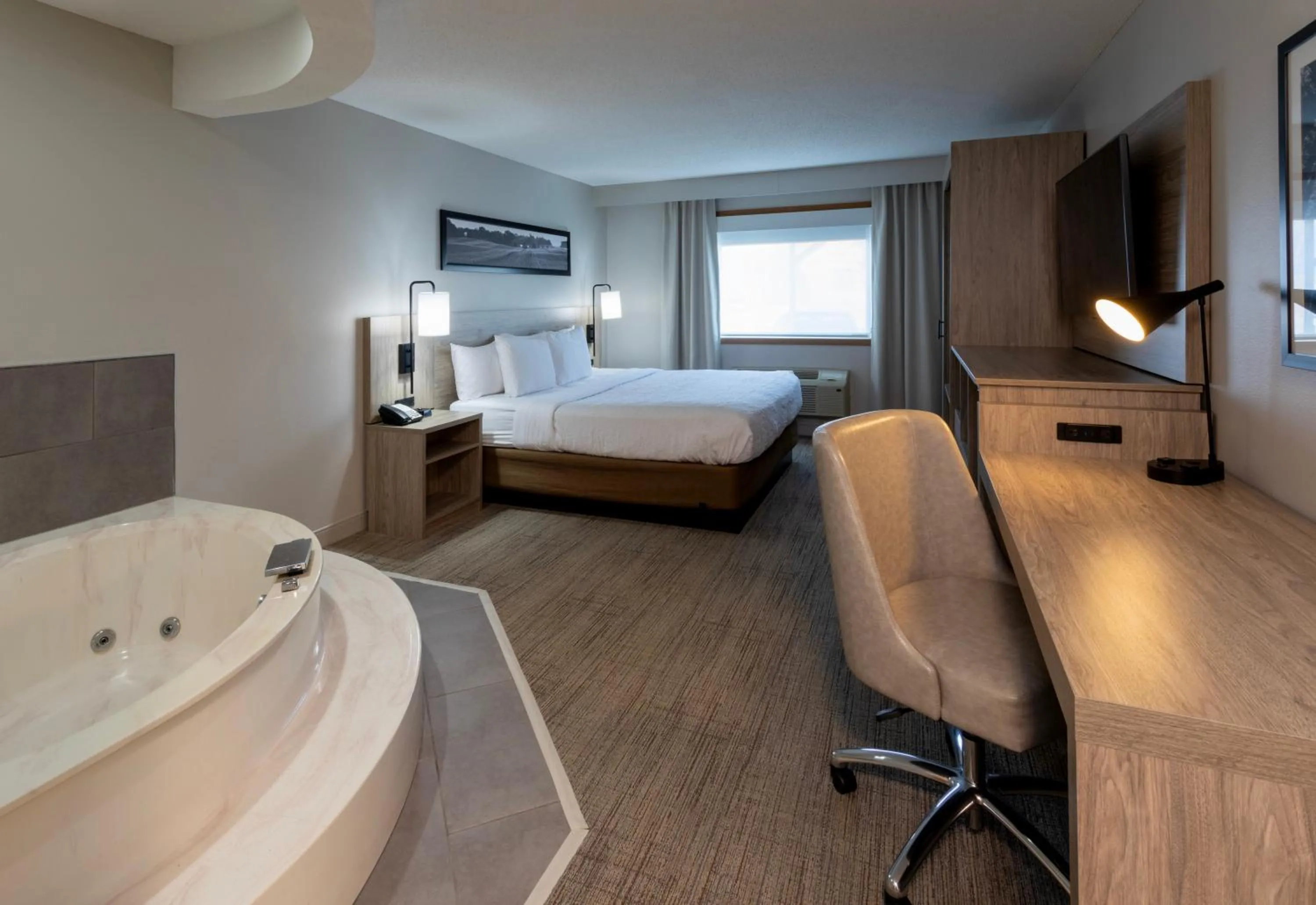 Bed in GrandStay Hotel & Suites