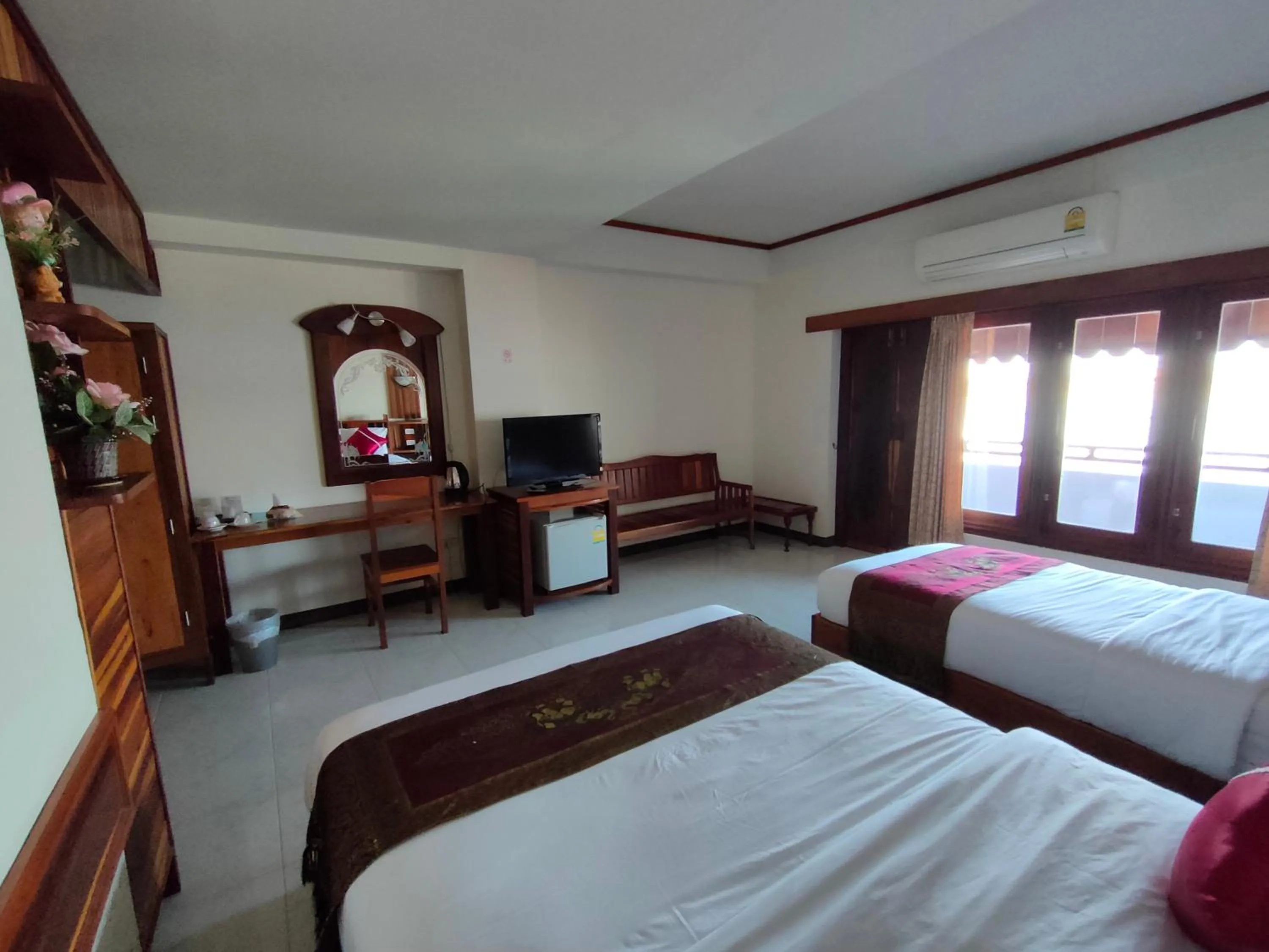 Bed in Riverfront Hotel Mukdahan