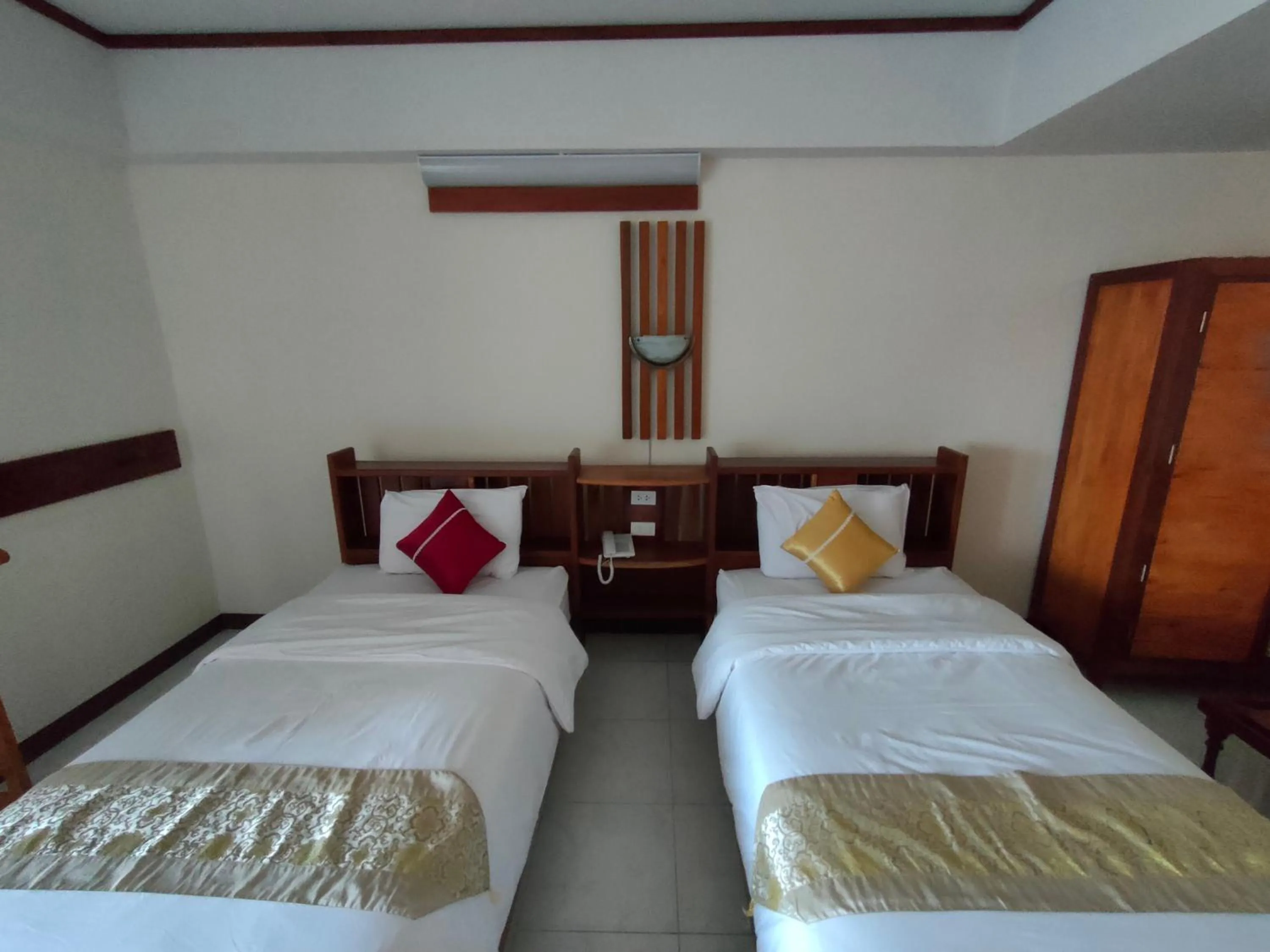 Bed in Riverfront Hotel Mukdahan
