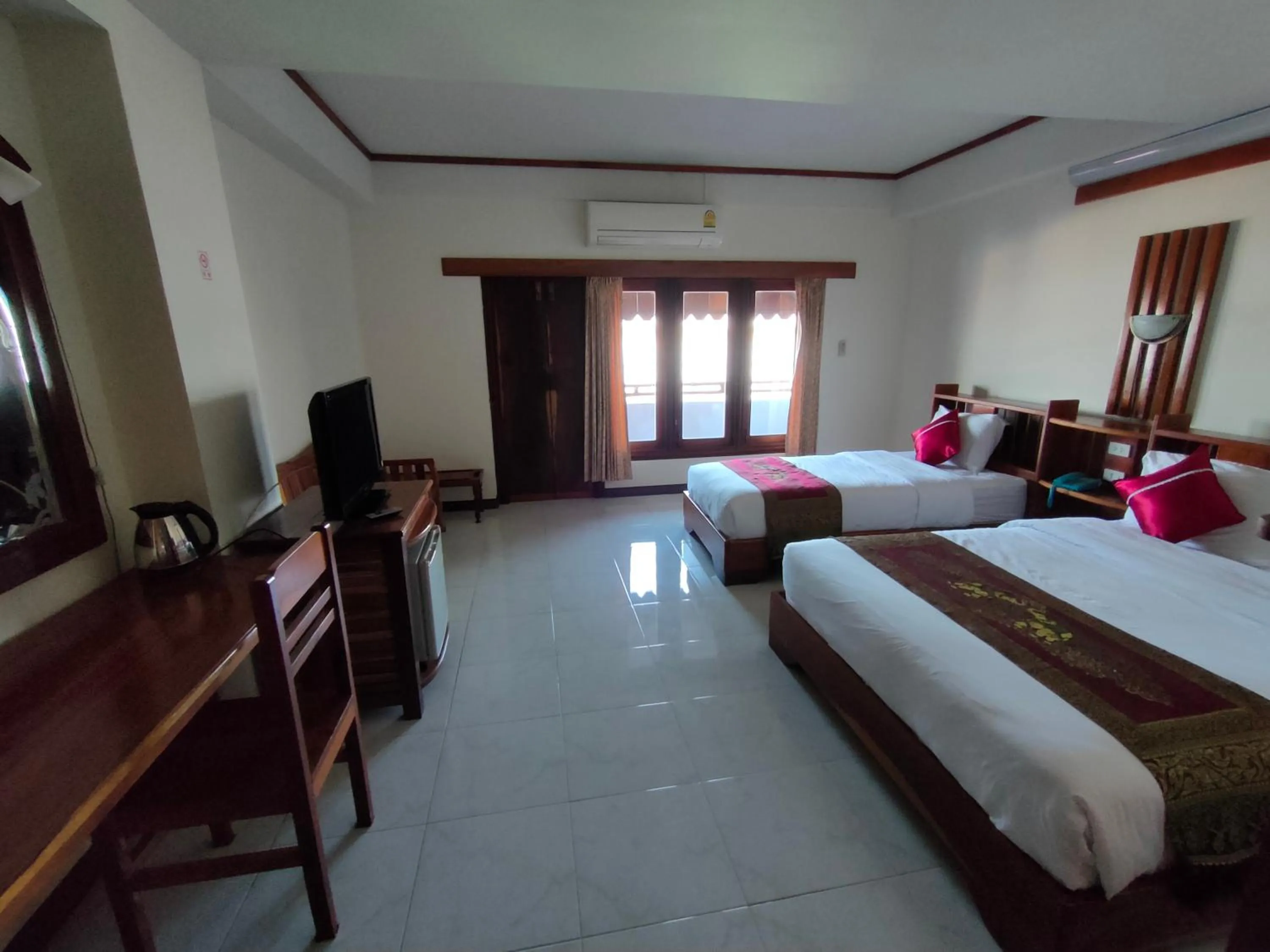 Bed in Riverfront Hotel Mukdahan