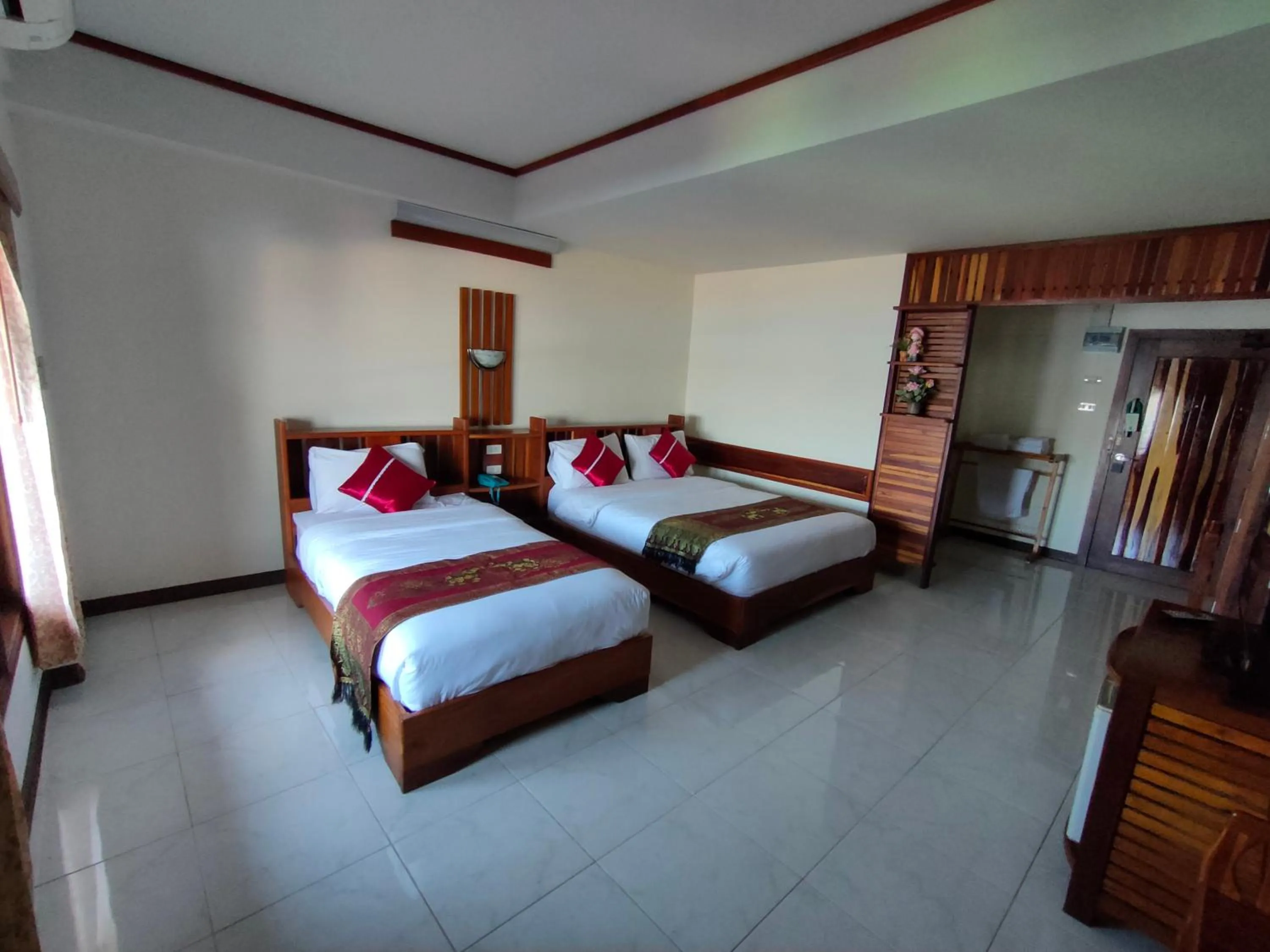 Bed in Riverfront Hotel Mukdahan