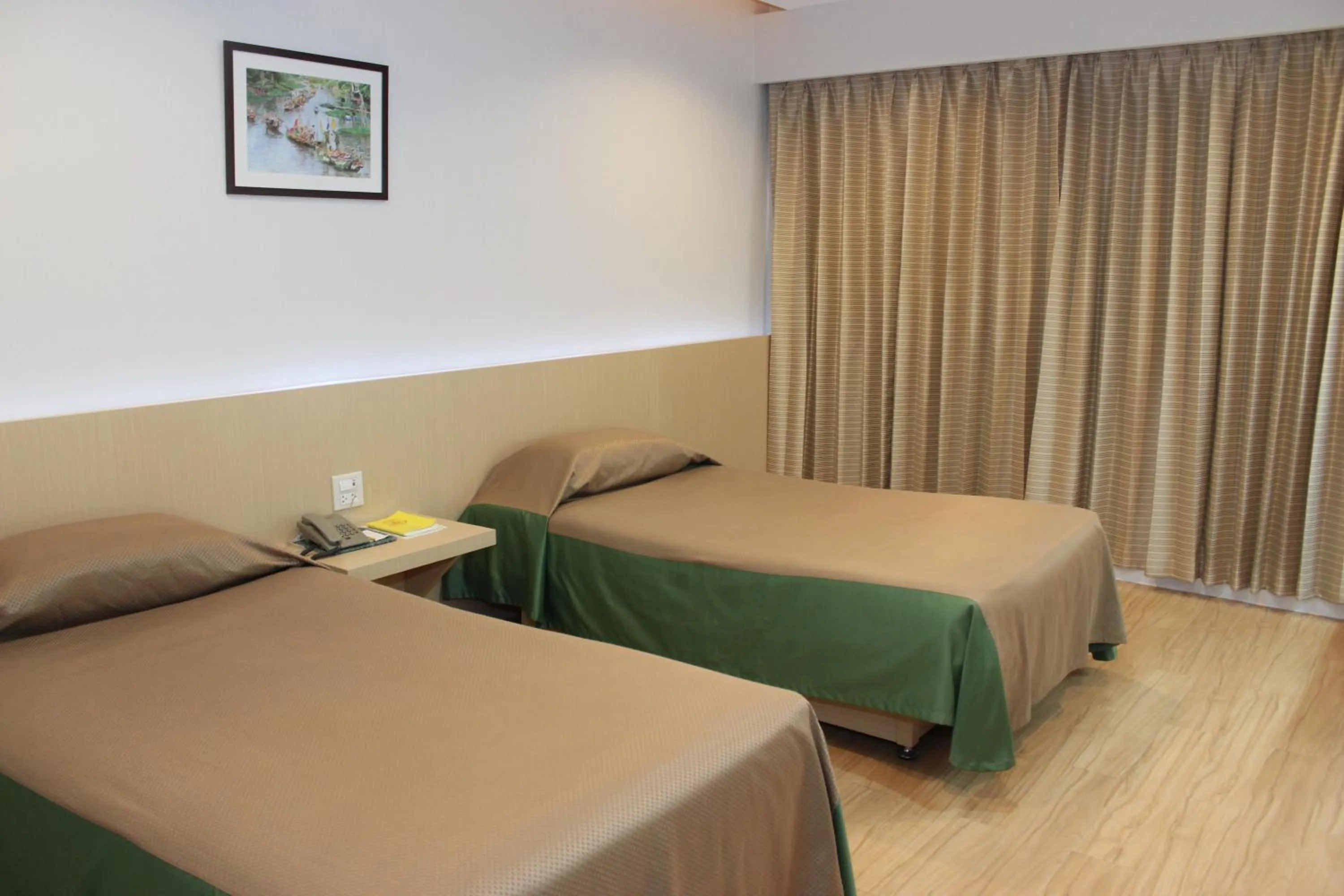 Bed in Charoen Hotel