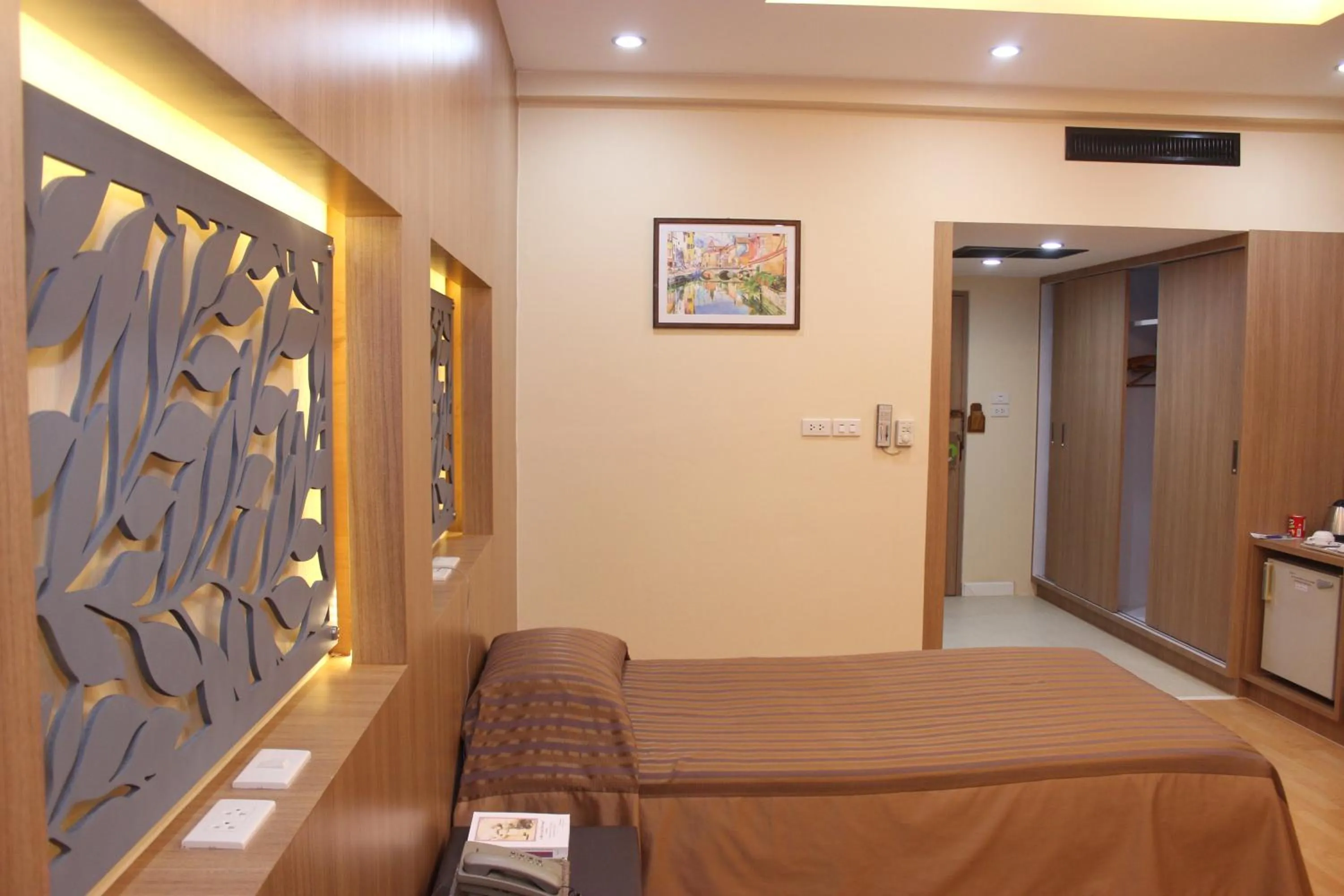 Bed in Charoen Hotel