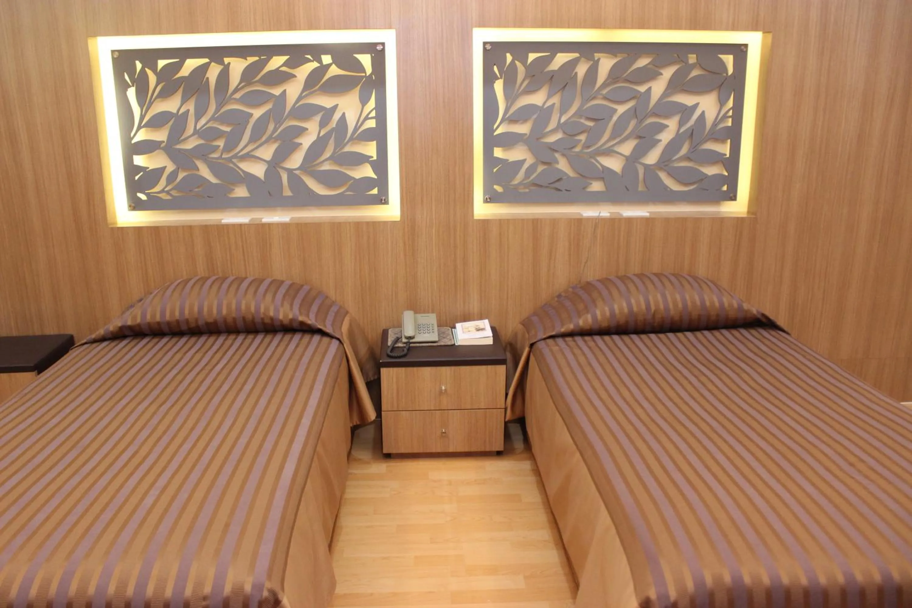 Bed in Charoen Hotel