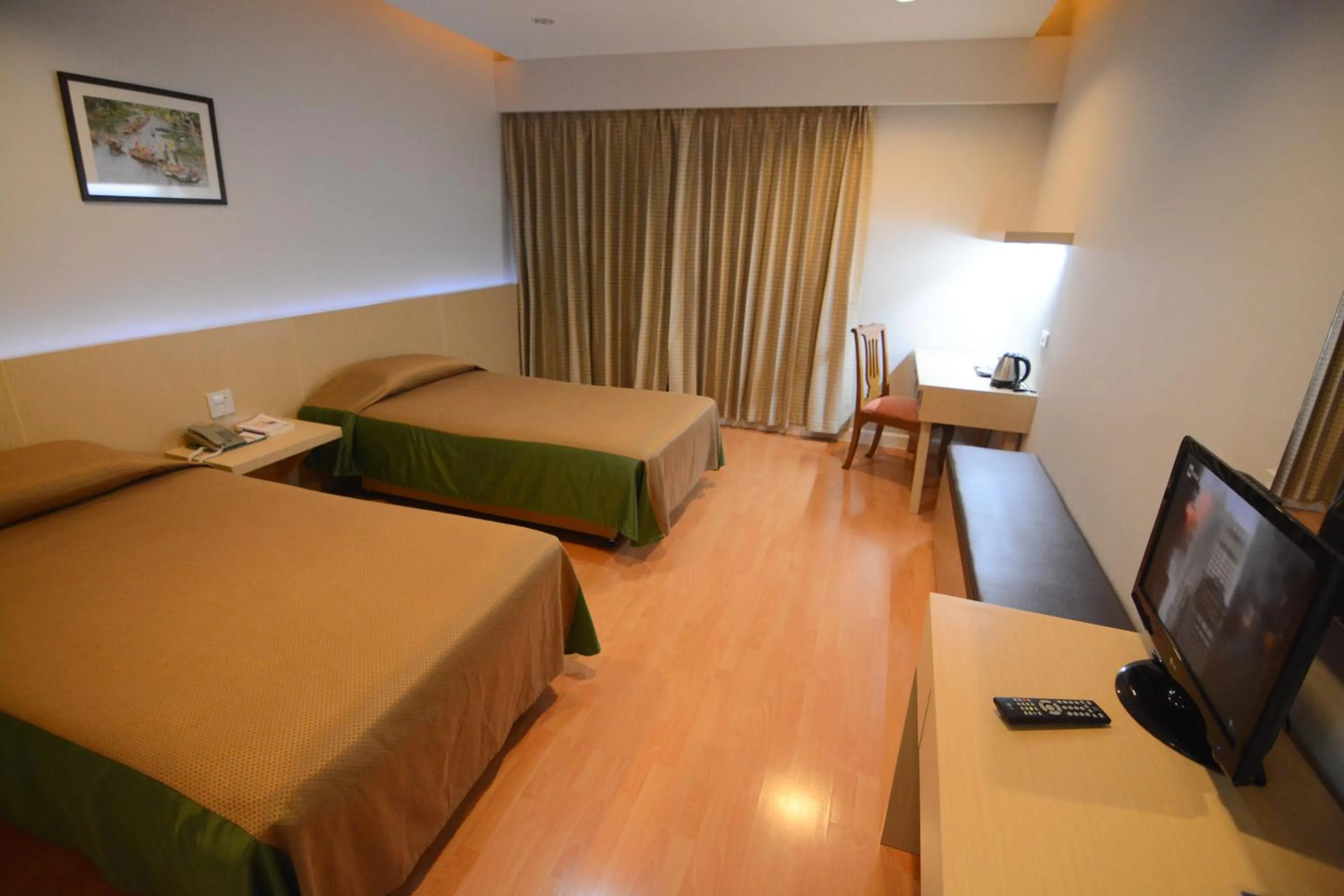 Bed in Charoen Hotel