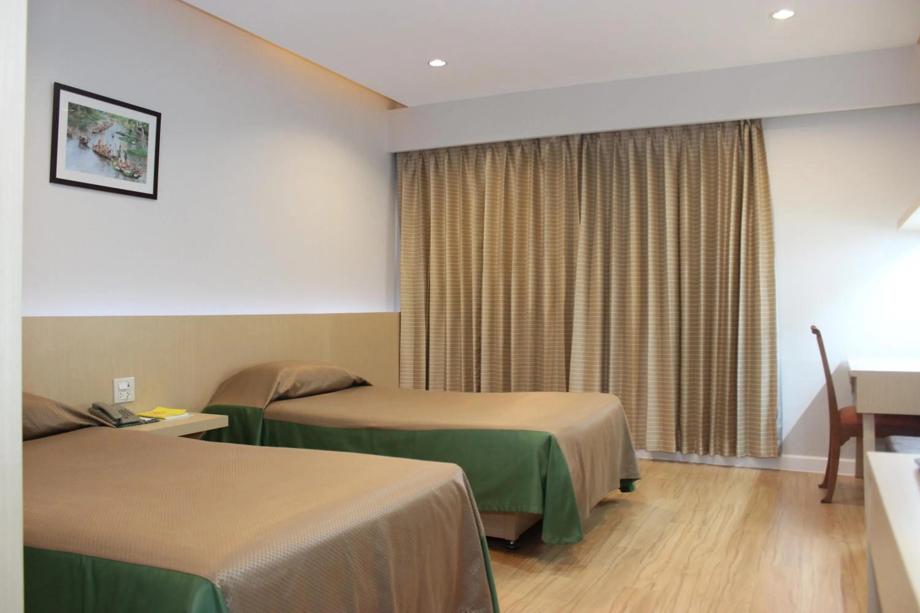 Bed in Charoen Hotel