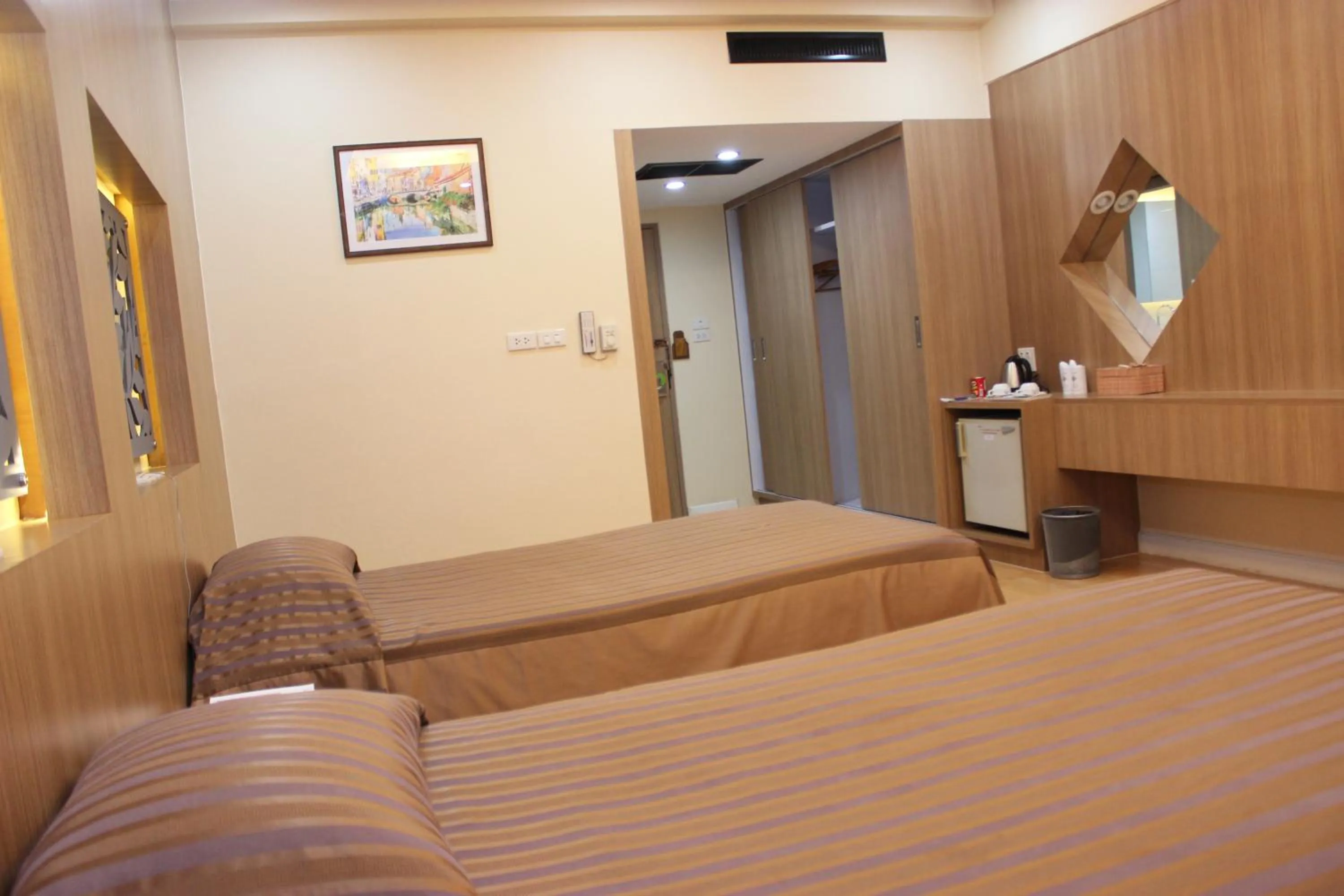 Bed in Charoen Hotel