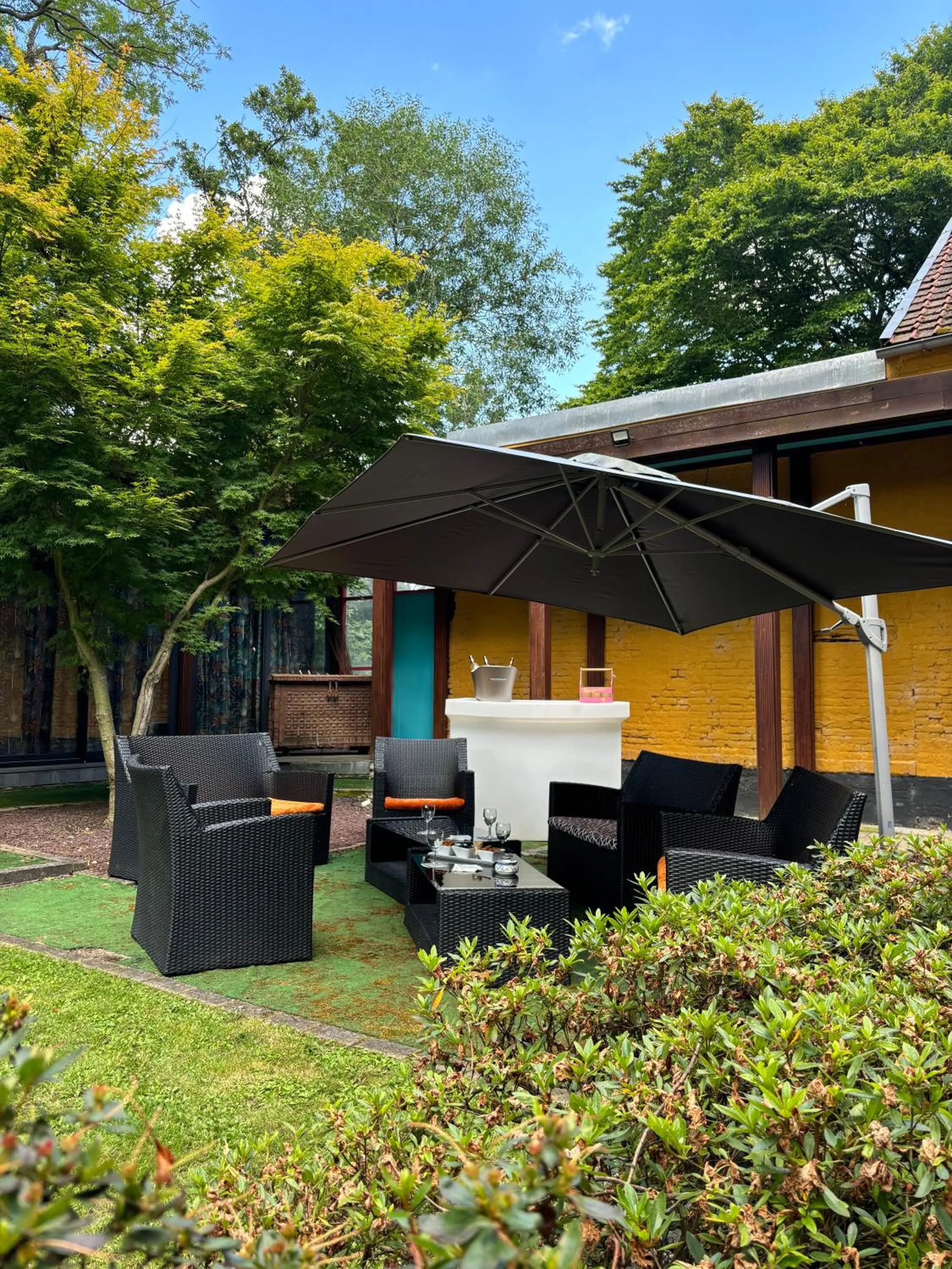 Garden in LOGIS HÔTEL-RESTAURANT - Le Moulin d'Artres