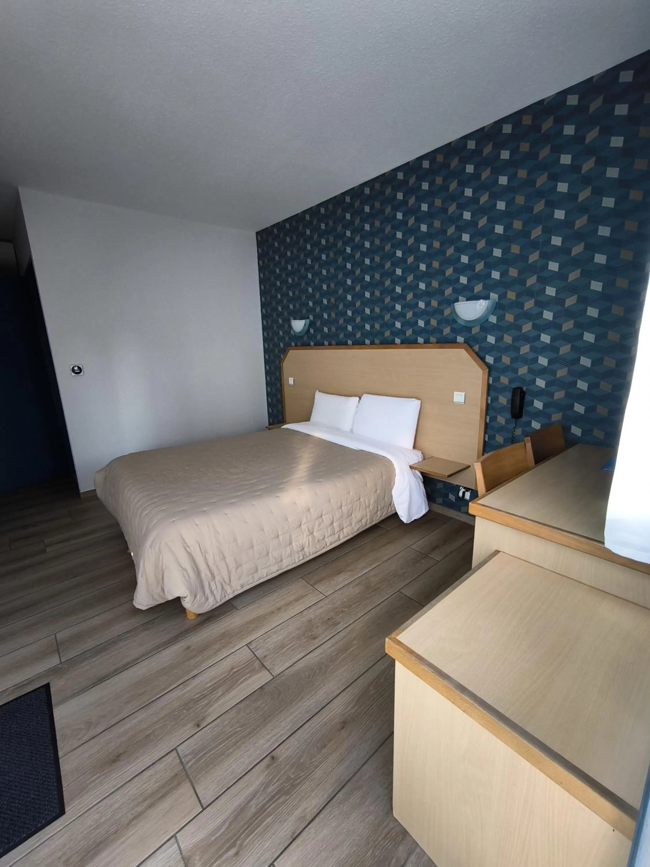 Photo of the whole room, Bed in Hôtel Le Laury's