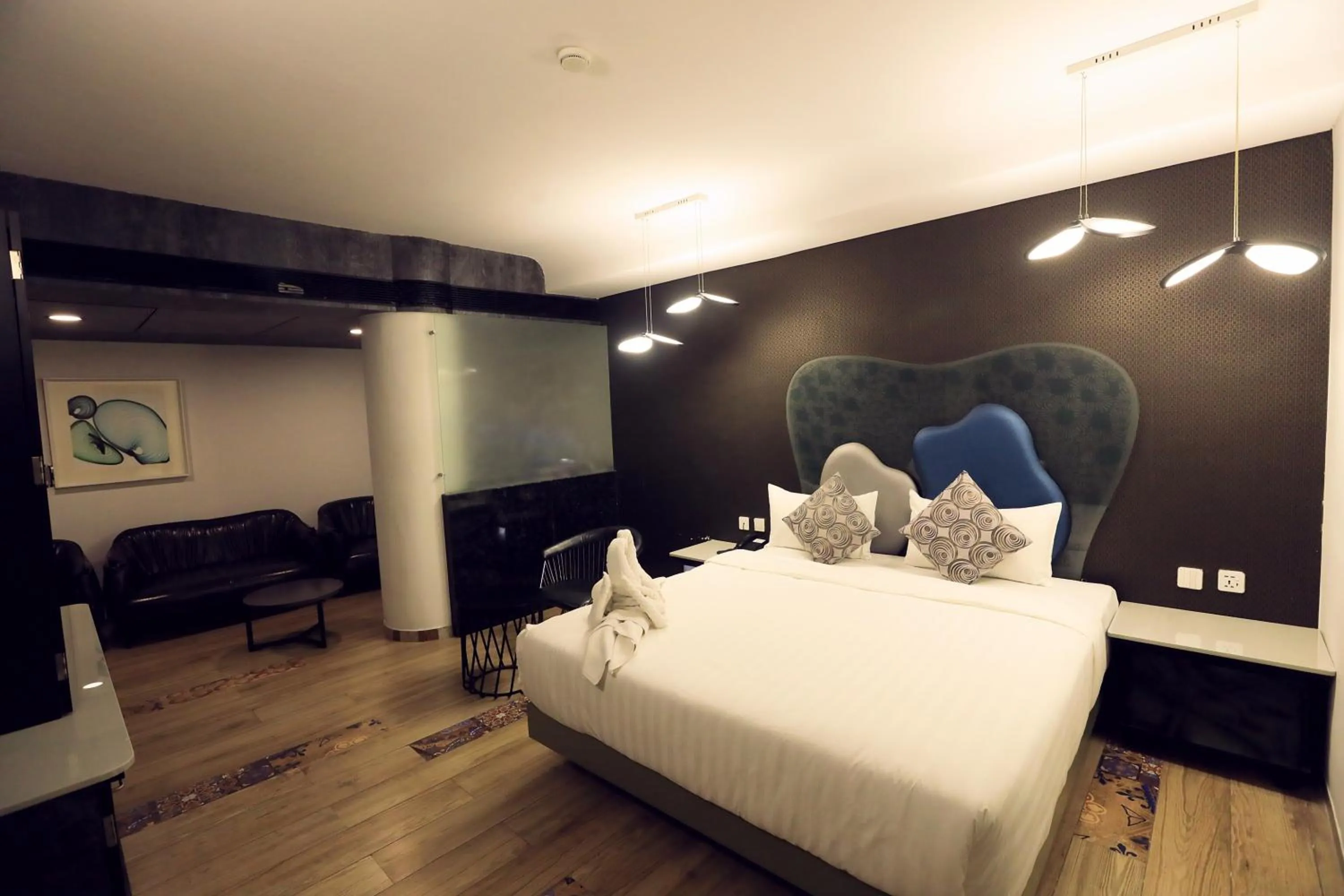 Bed in Humming Bird Hotel & Banquet