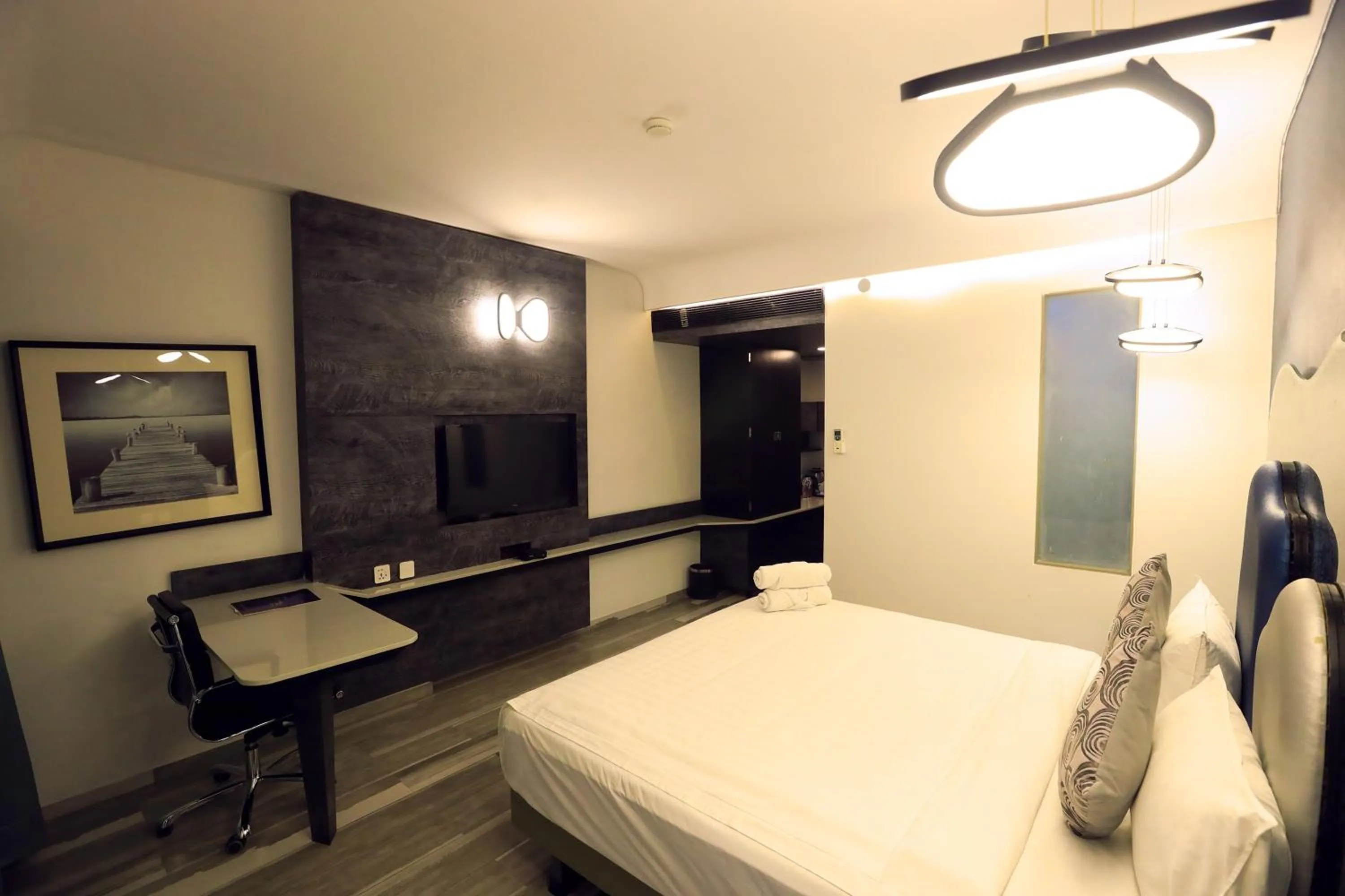 Bed in Humming Bird Hotel & Banquet