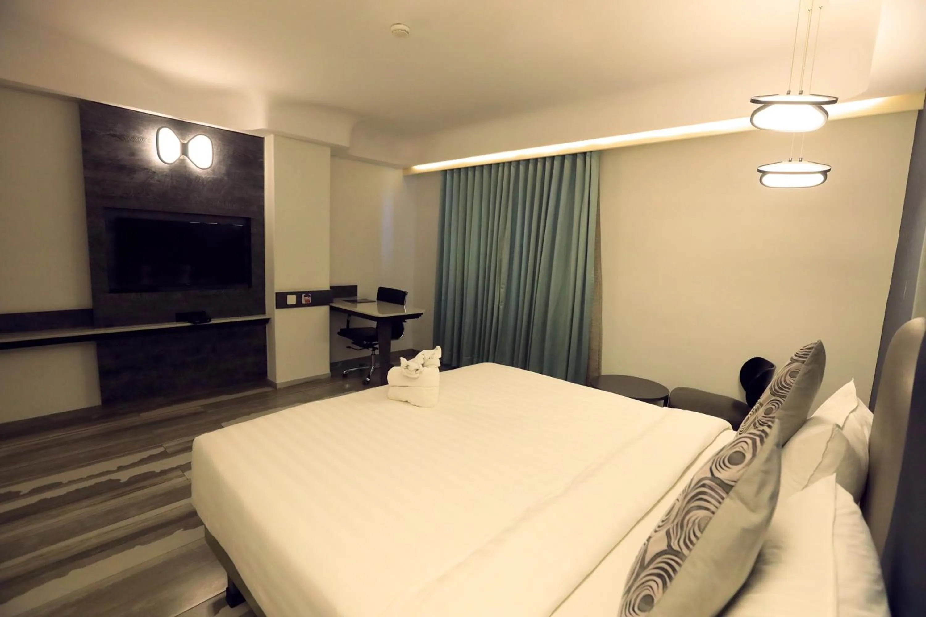 Bed in Humming Bird Hotel & Banquet