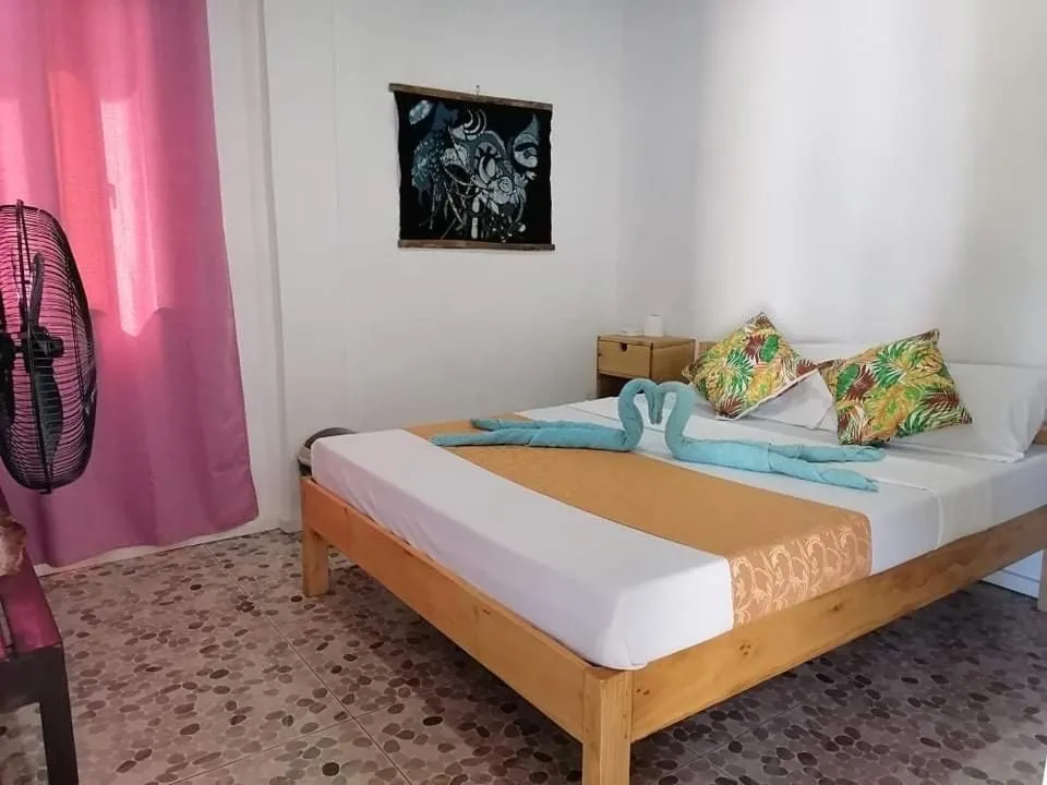 Bed in Mecaja Beach House