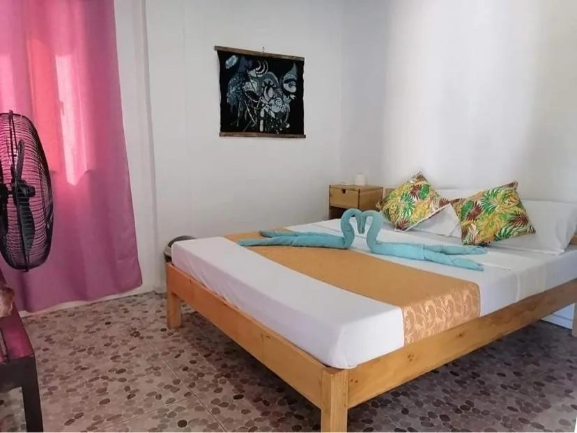 Bed in Mecaja Beach House