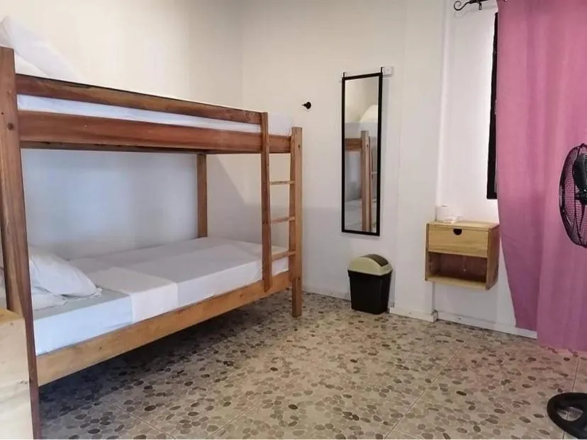 Bed in Mecaja Beach House