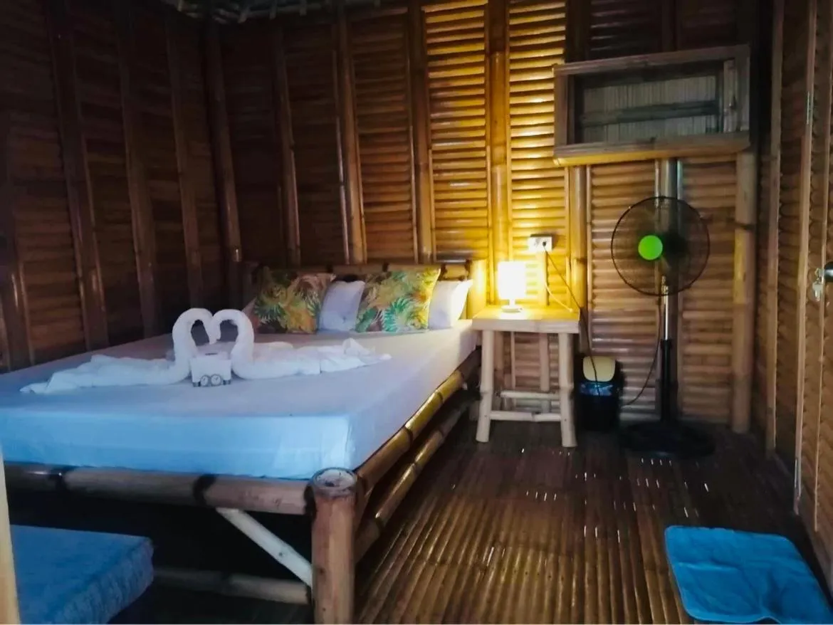 Bed in Mecaja Beach House