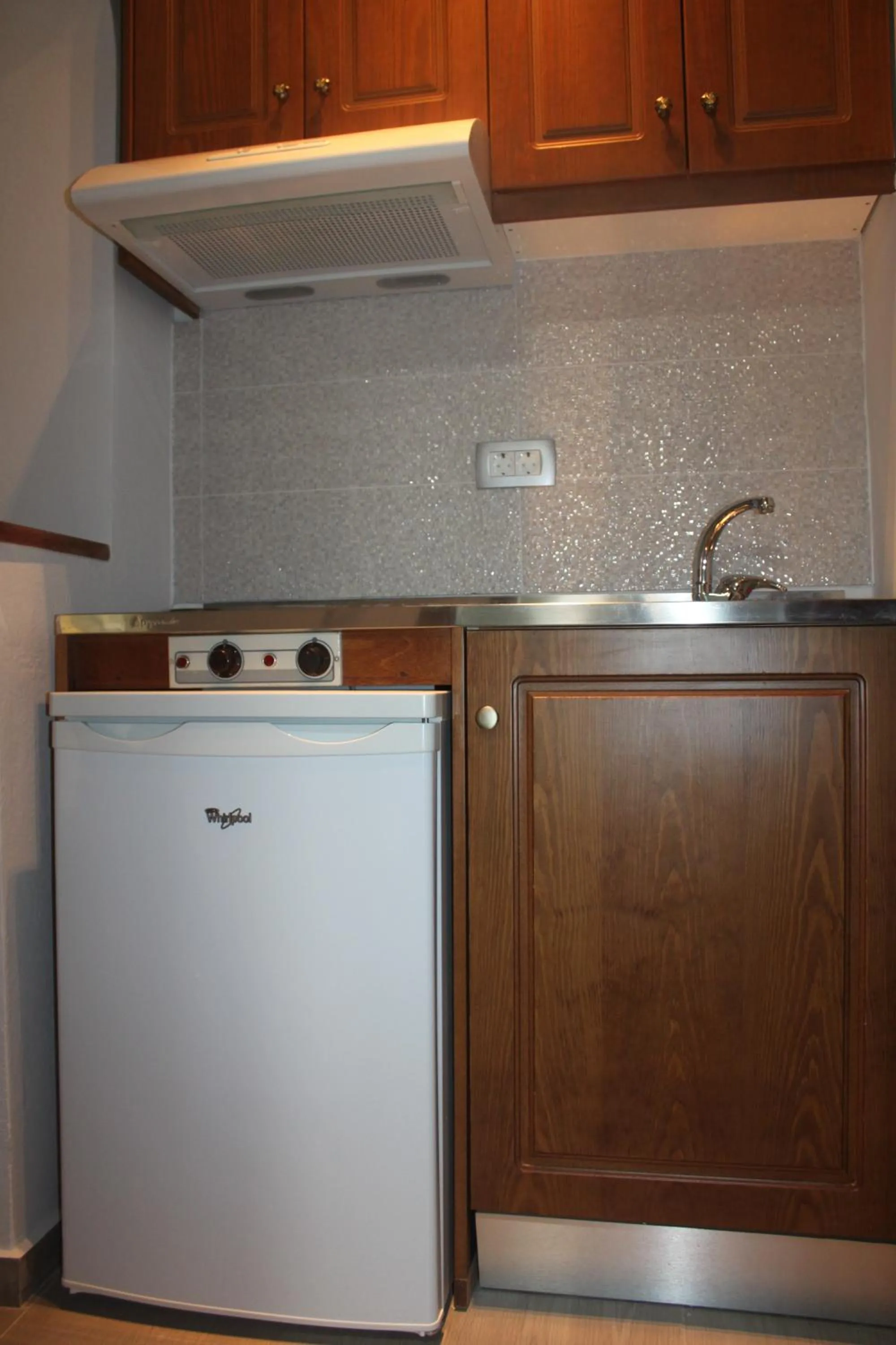 Kitchen or kitchenette in Sunny Suites