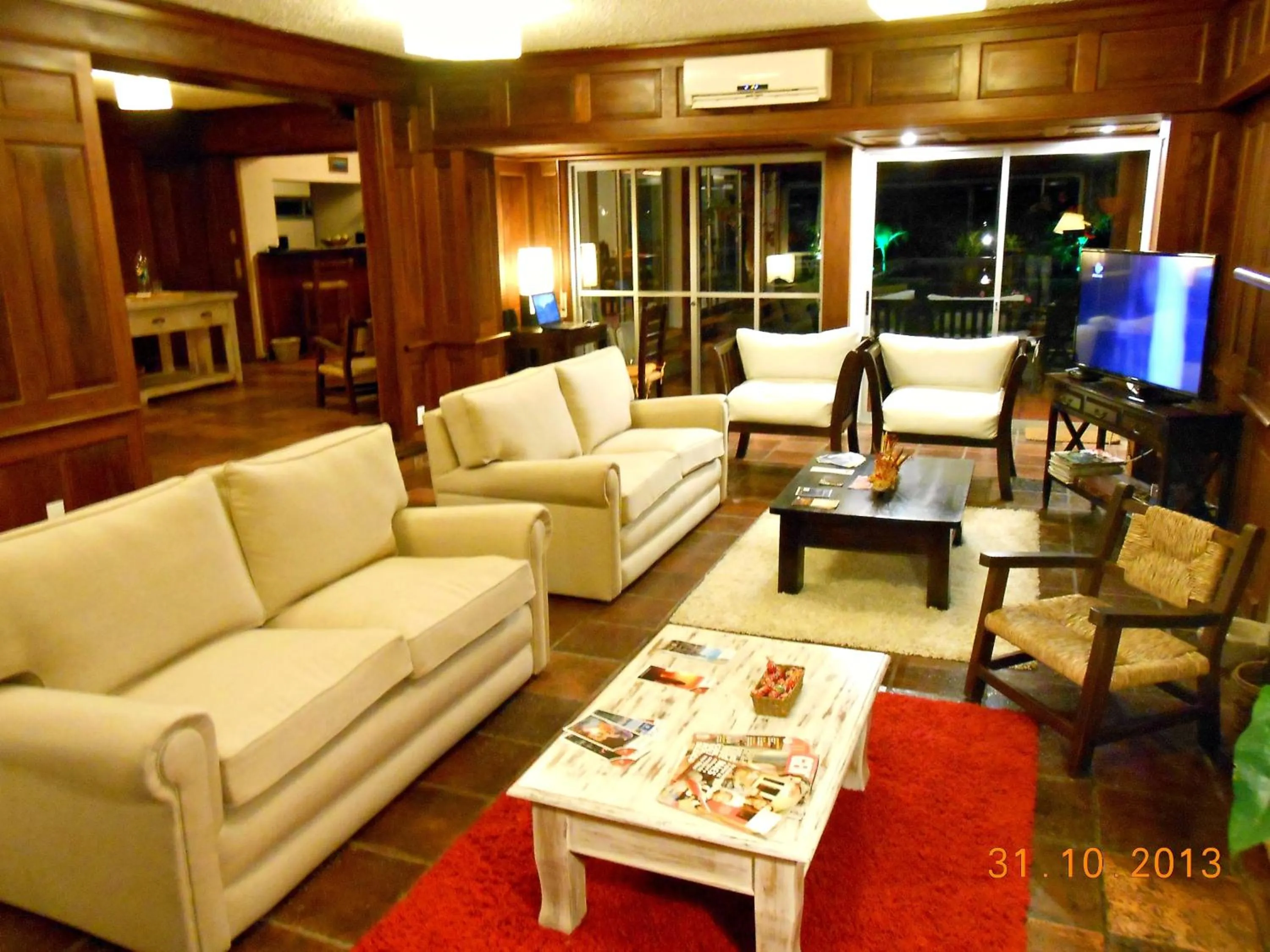 Communal lounge/ TV room in Petit Chateau Hotel Boutique