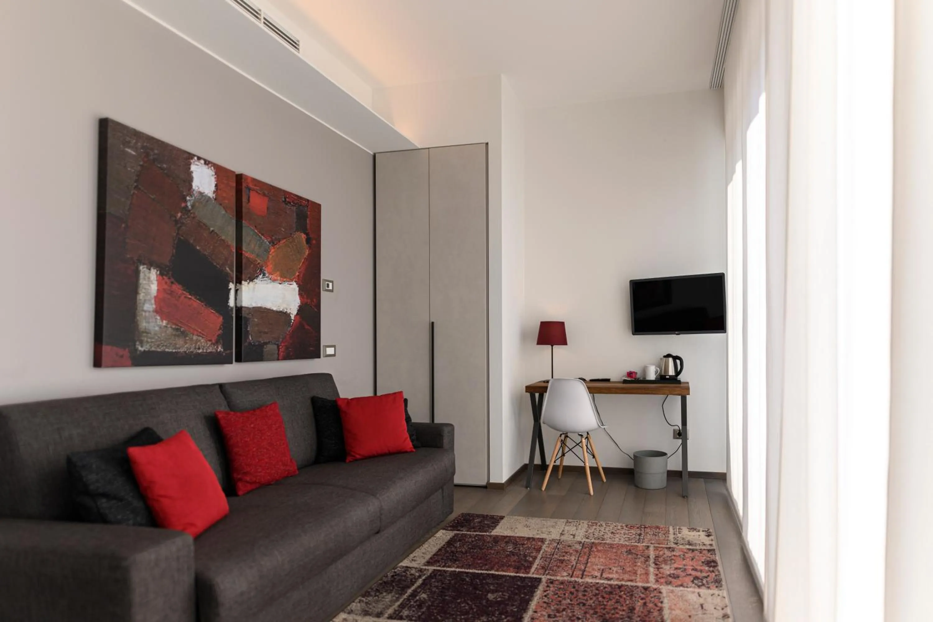 Communal lounge/ TV room in B&B The Attico