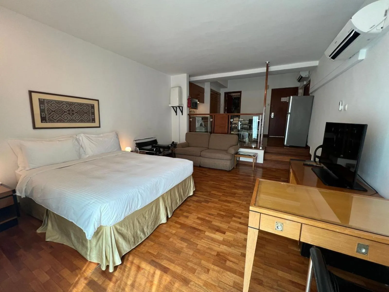 Photo of the whole room, Bed in Orchard Point Serviced Apartments