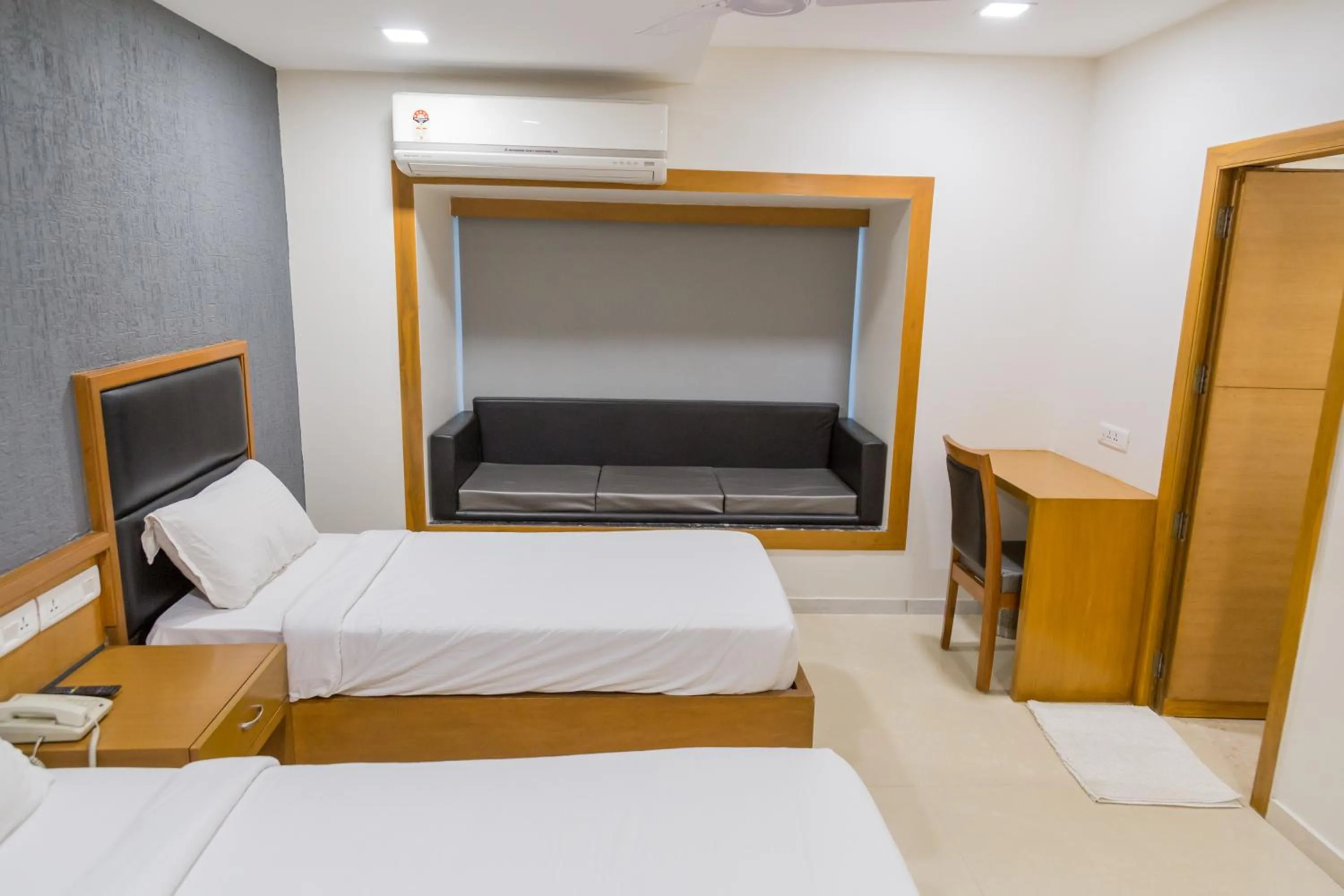 Photo of the whole room, Bed in Ginger Ahmedabad, Satellite