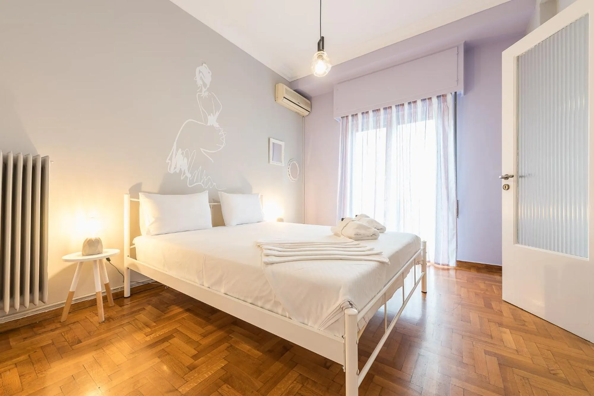 Bed in Athens Boutique Apartment by Cloudkeys