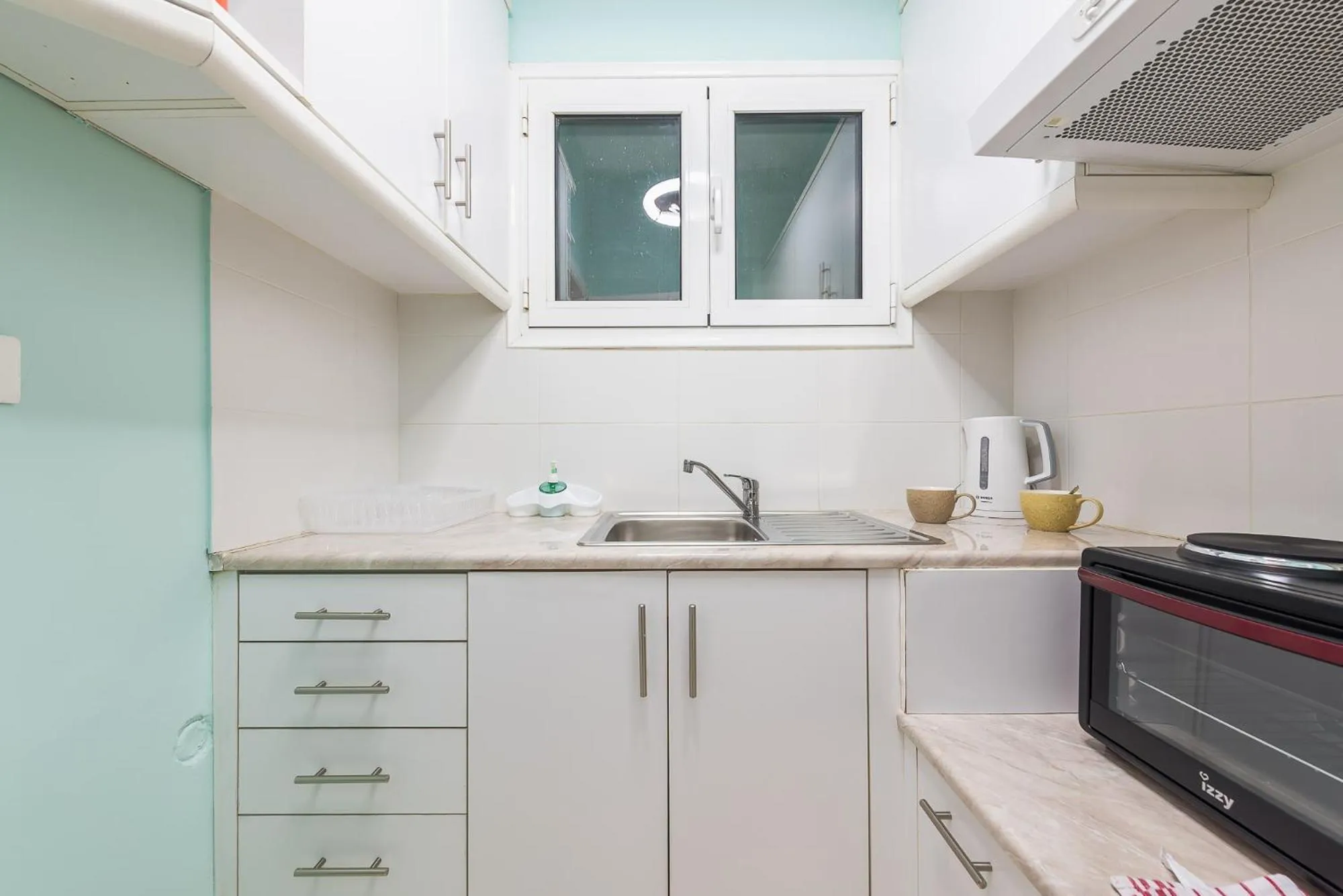 Kitchen or kitchenette in Athens Boutique Apartment by Cloudkeys