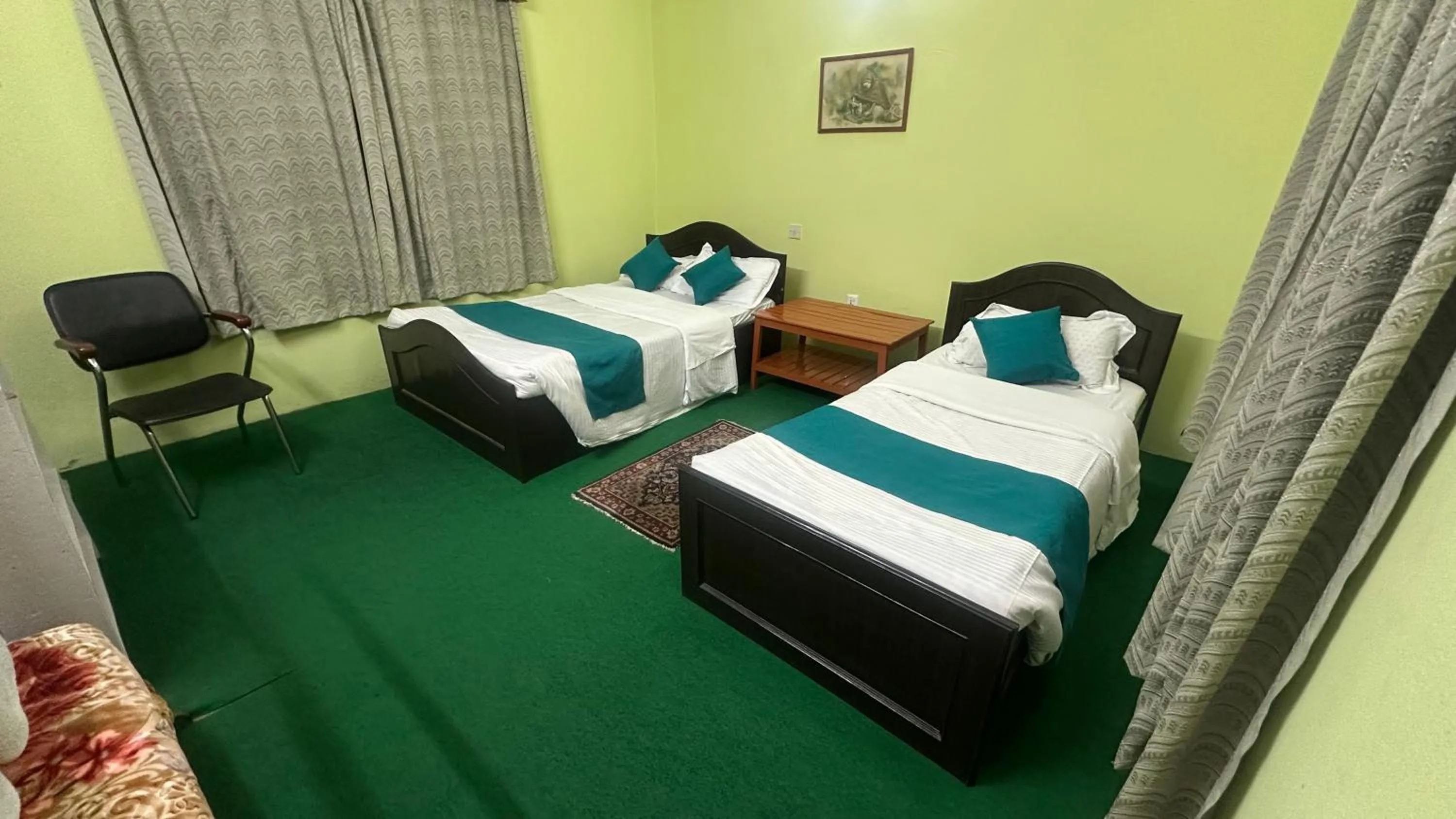 Photo of the whole room, Bed in New Pokhara Lodge - Pokhara Lakeside