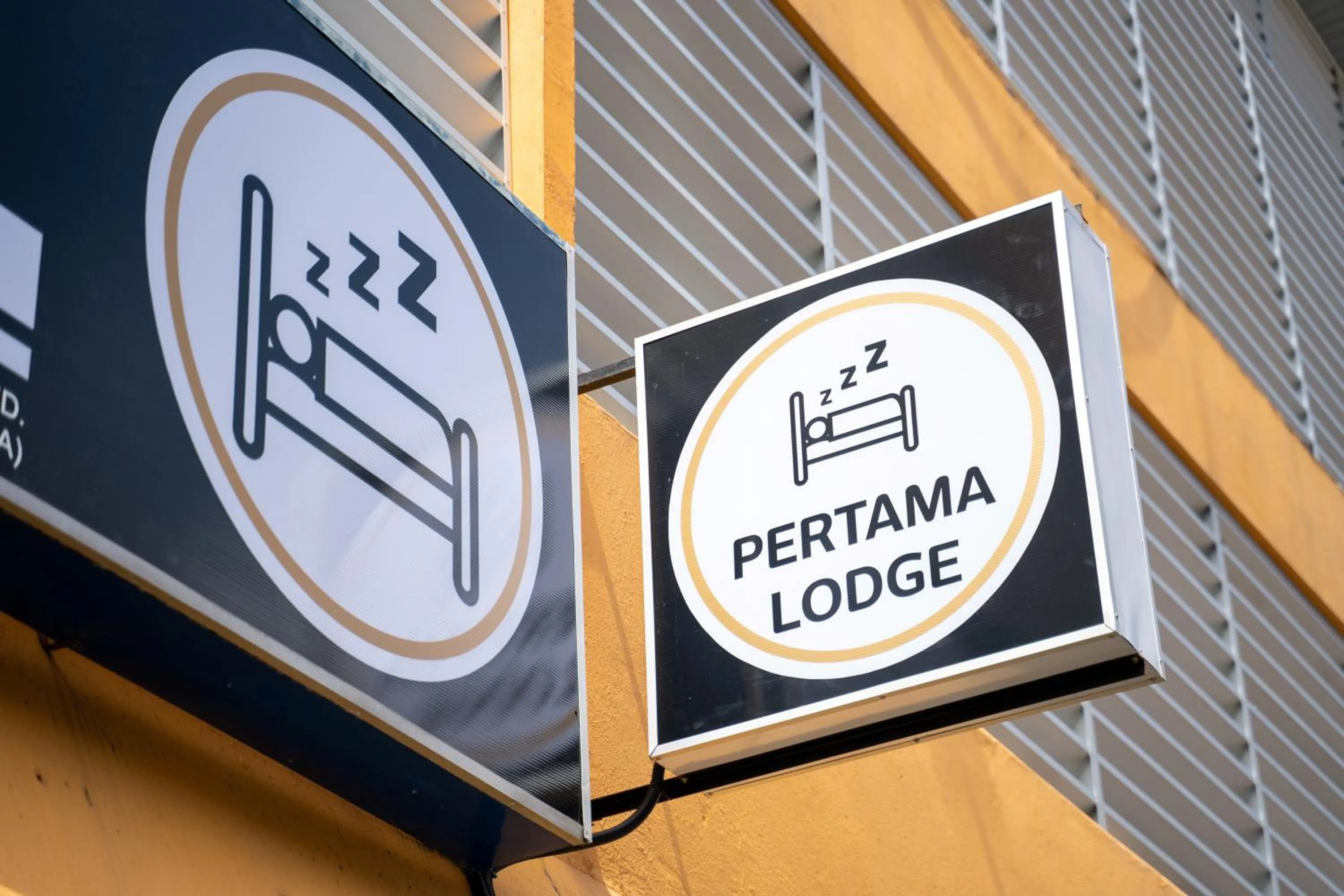 Property logo or sign in Pertama Lodge