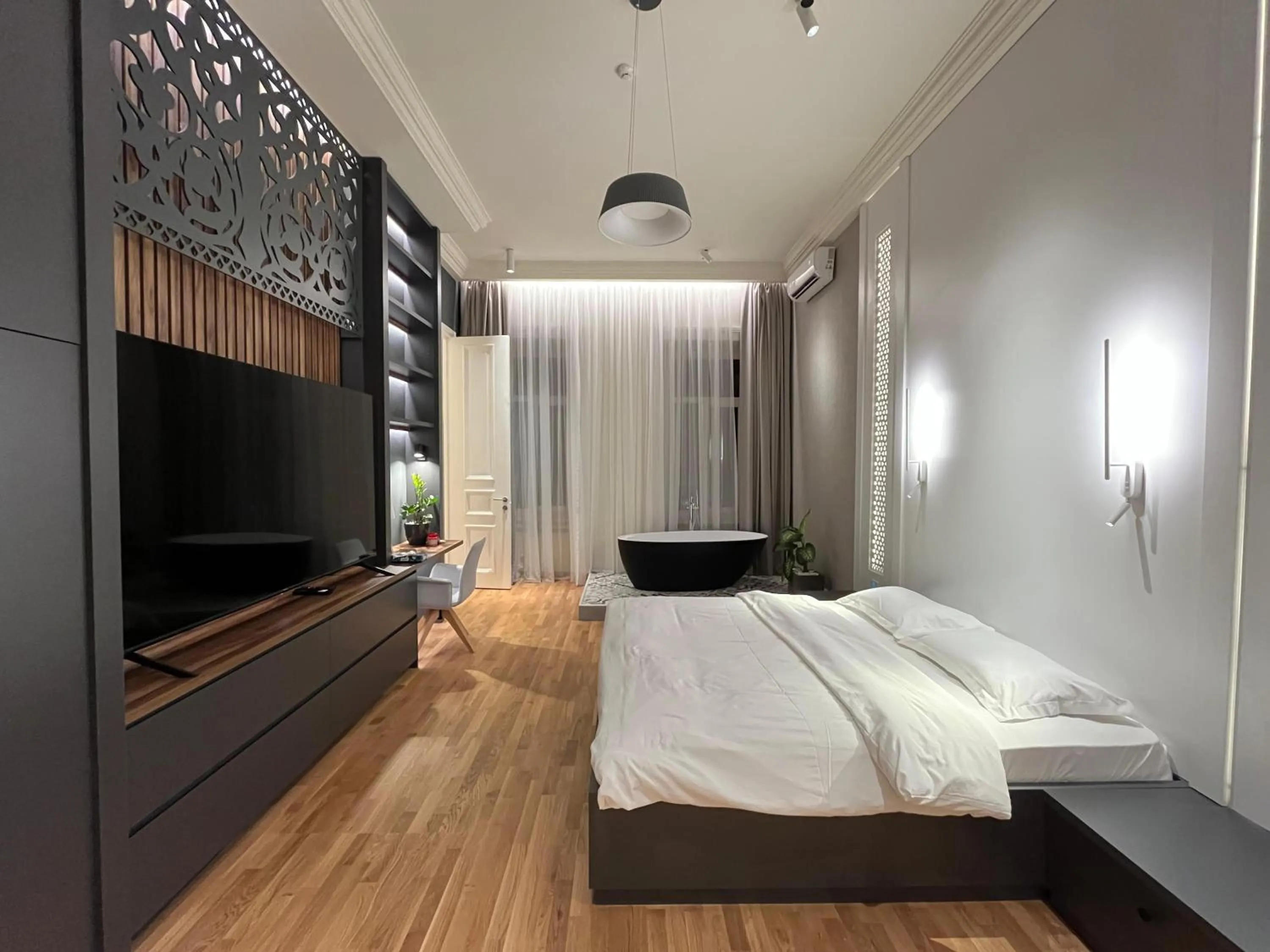 Communal lounge/ TV room, Bed in Paskunji Residence