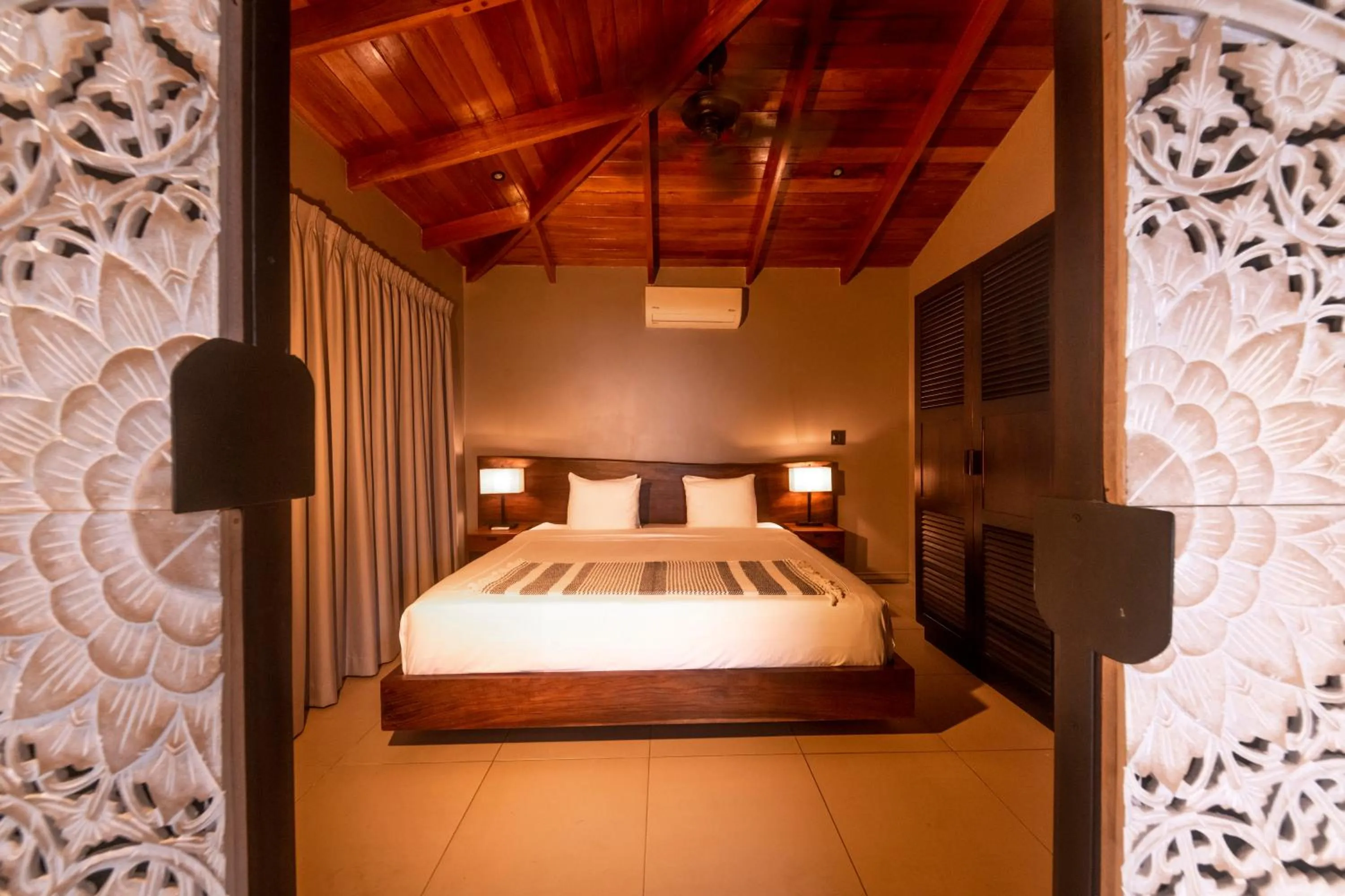 Bed in Oxygen Jungle Villas & Spa