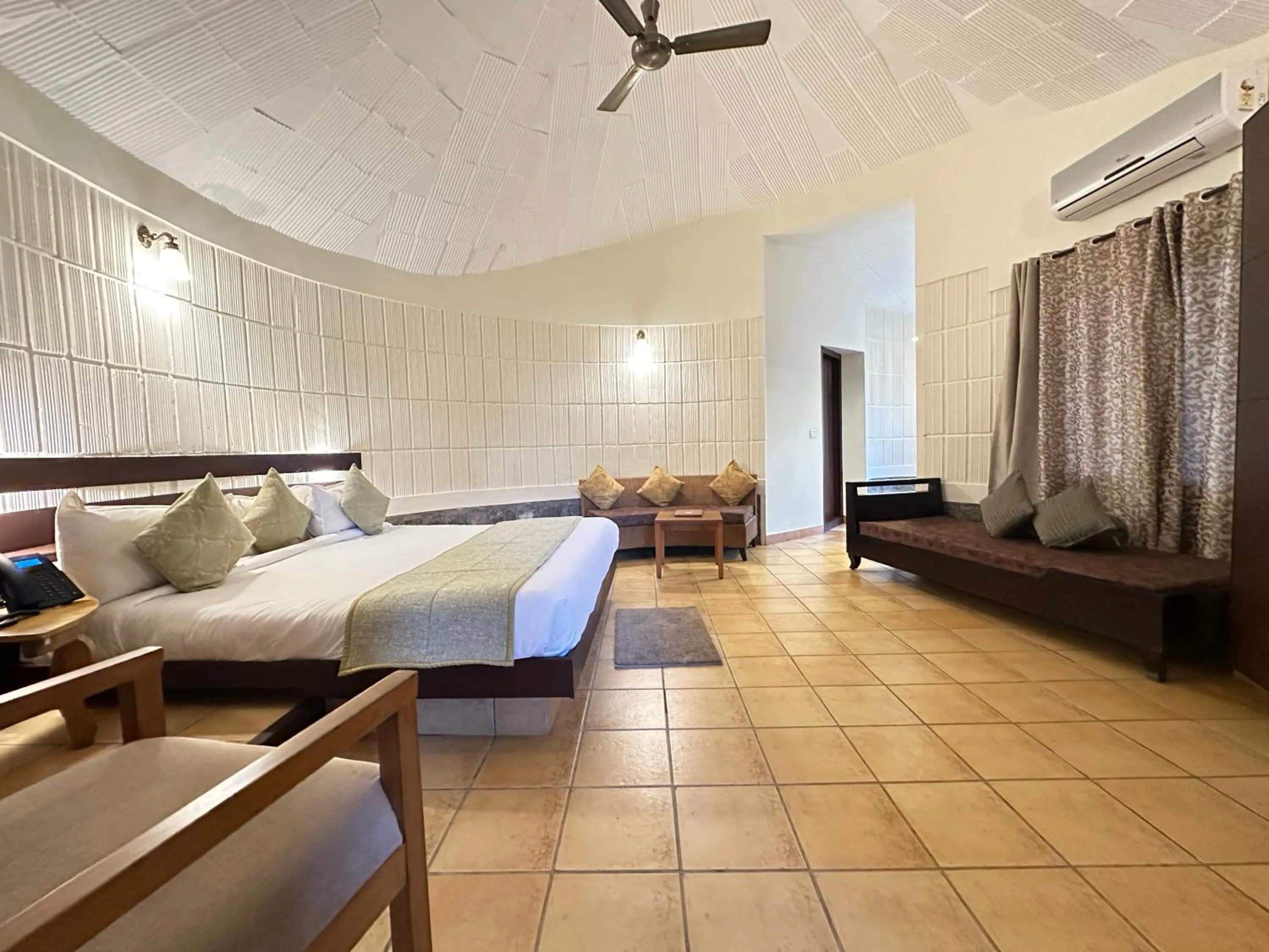 Bed in Kadkani River Resort Coorg