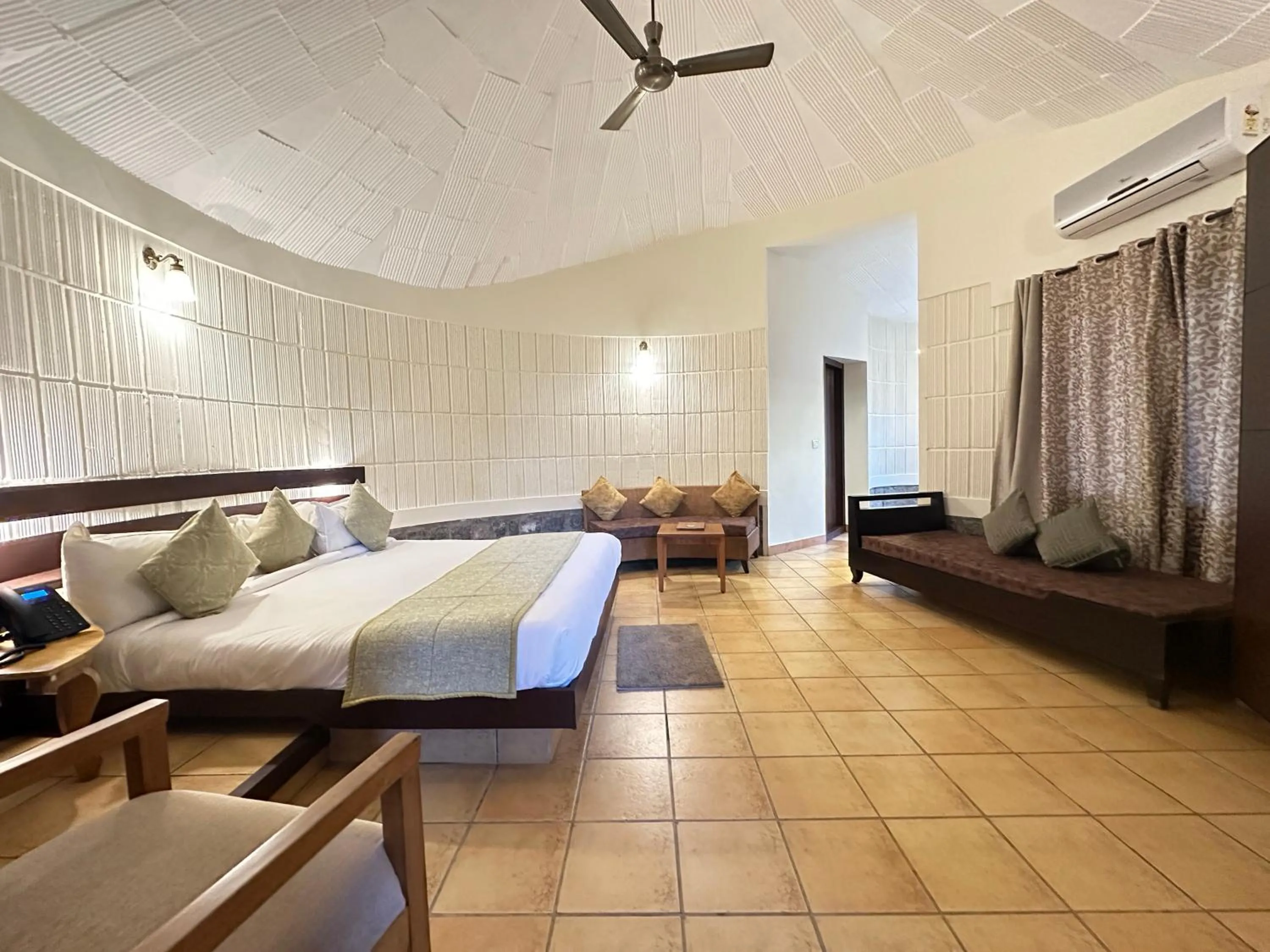 Bed in Kadkani River Resort Coorg